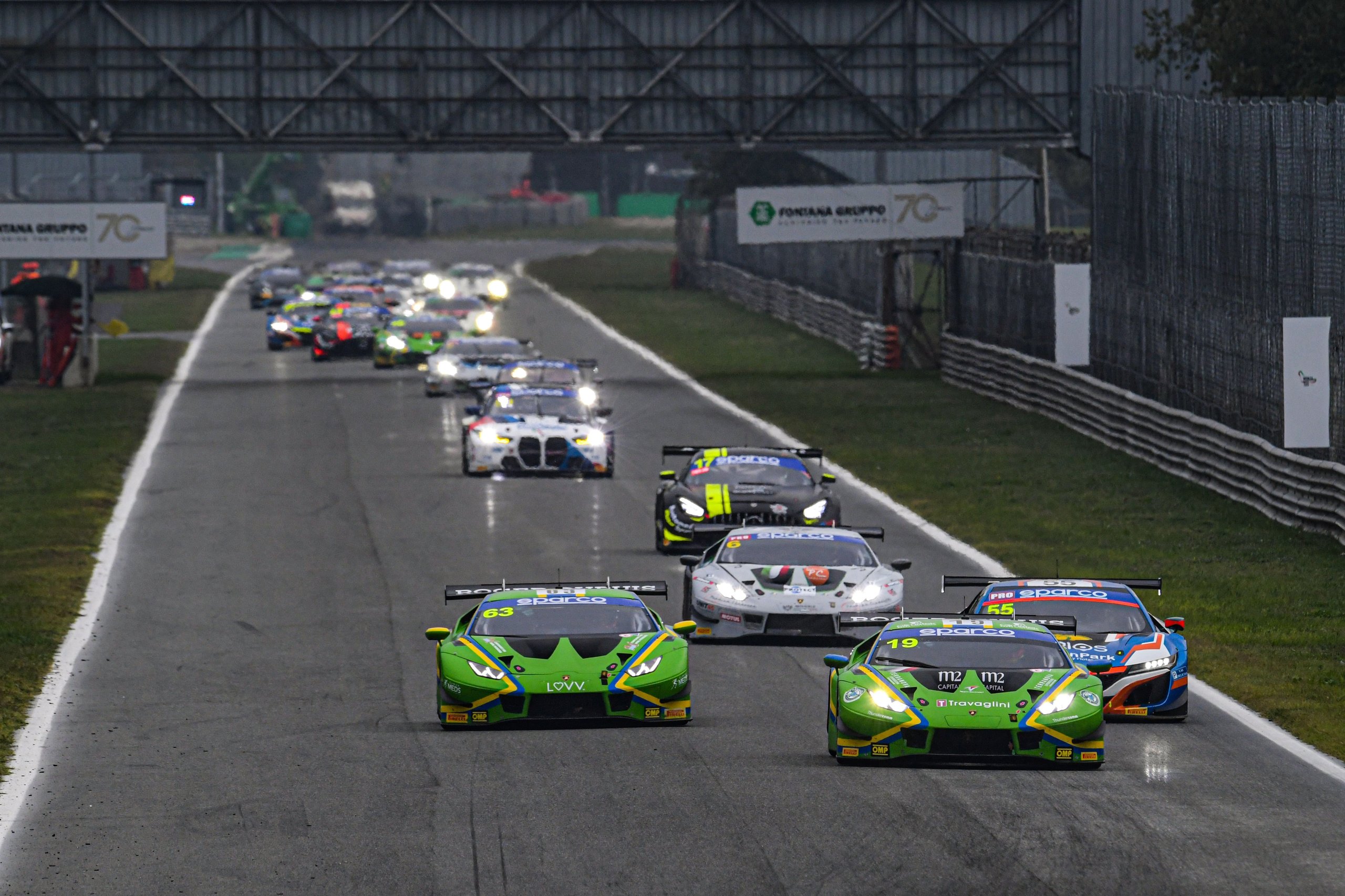 A Gearbox Failure, A One-Point Margin, And Lamborghini'S Third Italian Gt Title In Five Years 7 Multiple lamborghini huracán gt3 evos racing in a pack down the straight at monza
