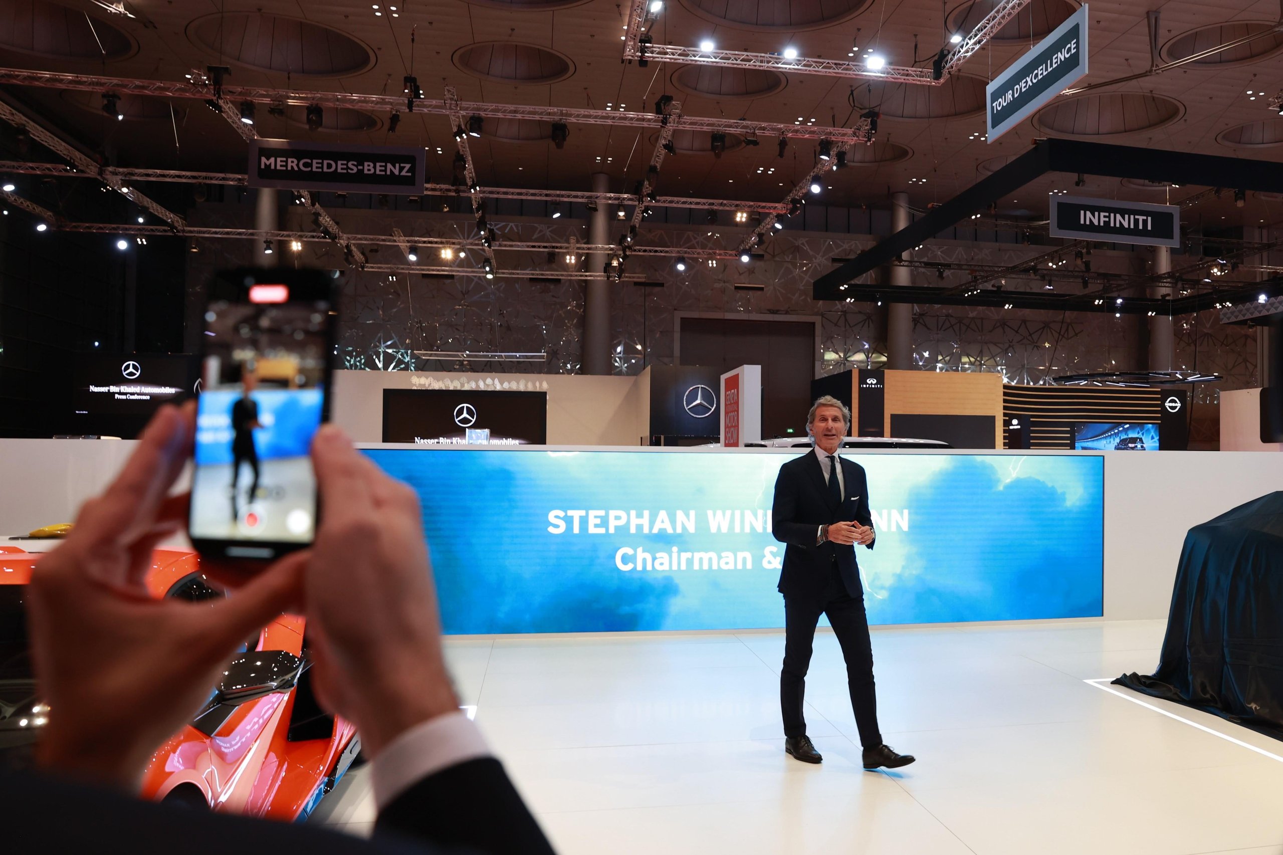 Lamborghini'S Lanzador Was The Star Of Gims Qatar. Then The Company Killed It. 7 Stephan winkelmann presenting on stage at gims qatar with the revuelto visible in the foreground