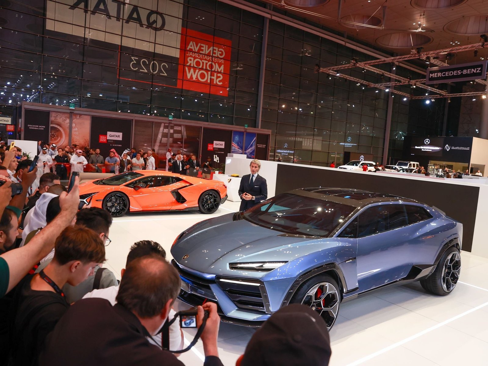 Blue Lamborghini Lanzador concept and orange Revuelto displayed together at GIMS Qatar 2023