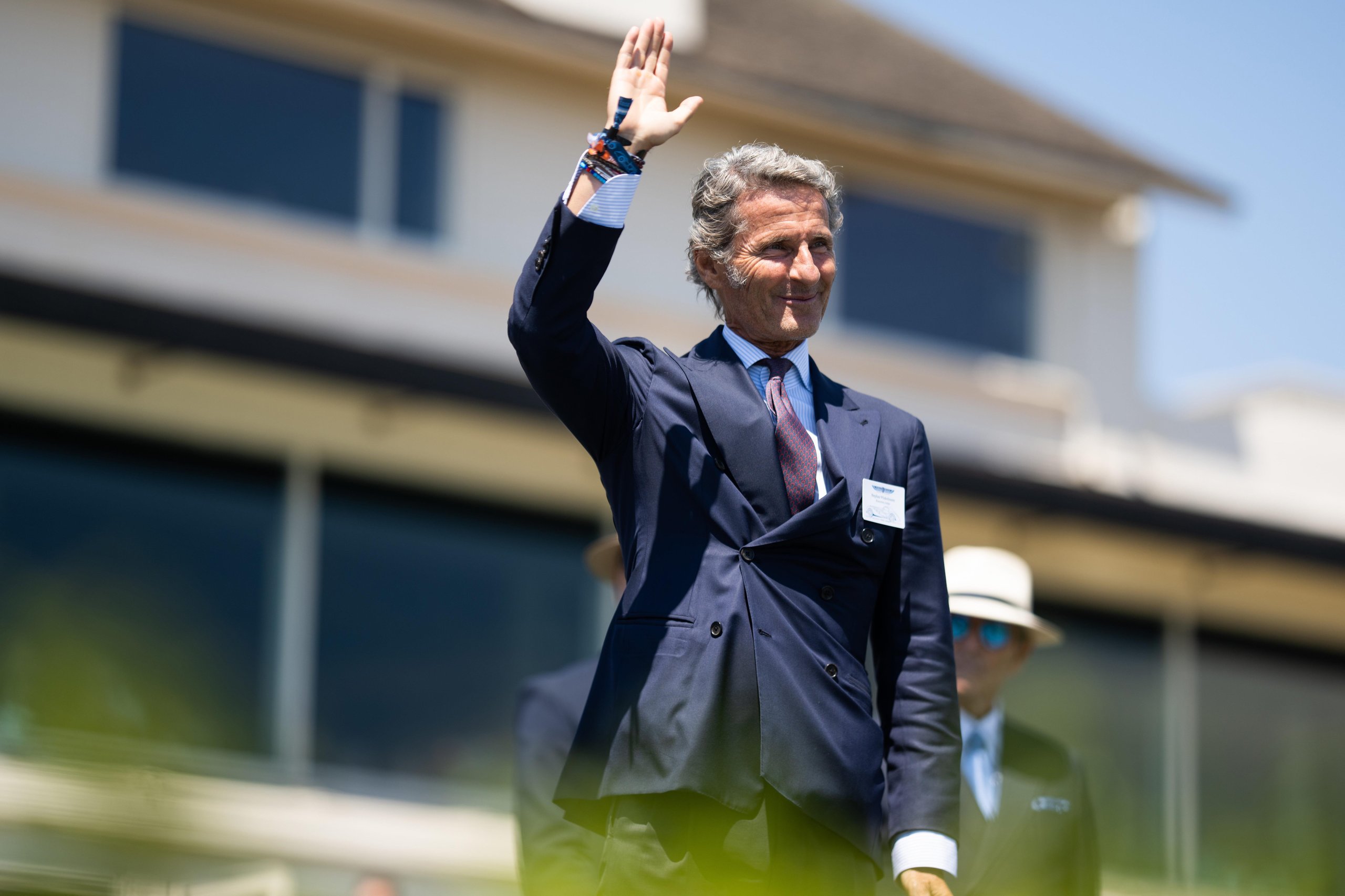 Lamborghini Killed The All-Electric Lanzador, And Its Customers Barely Flinched 5 Stephan winkelmann, ceo of lamborghini, waving to the crowd at pebble beach in a navy suit