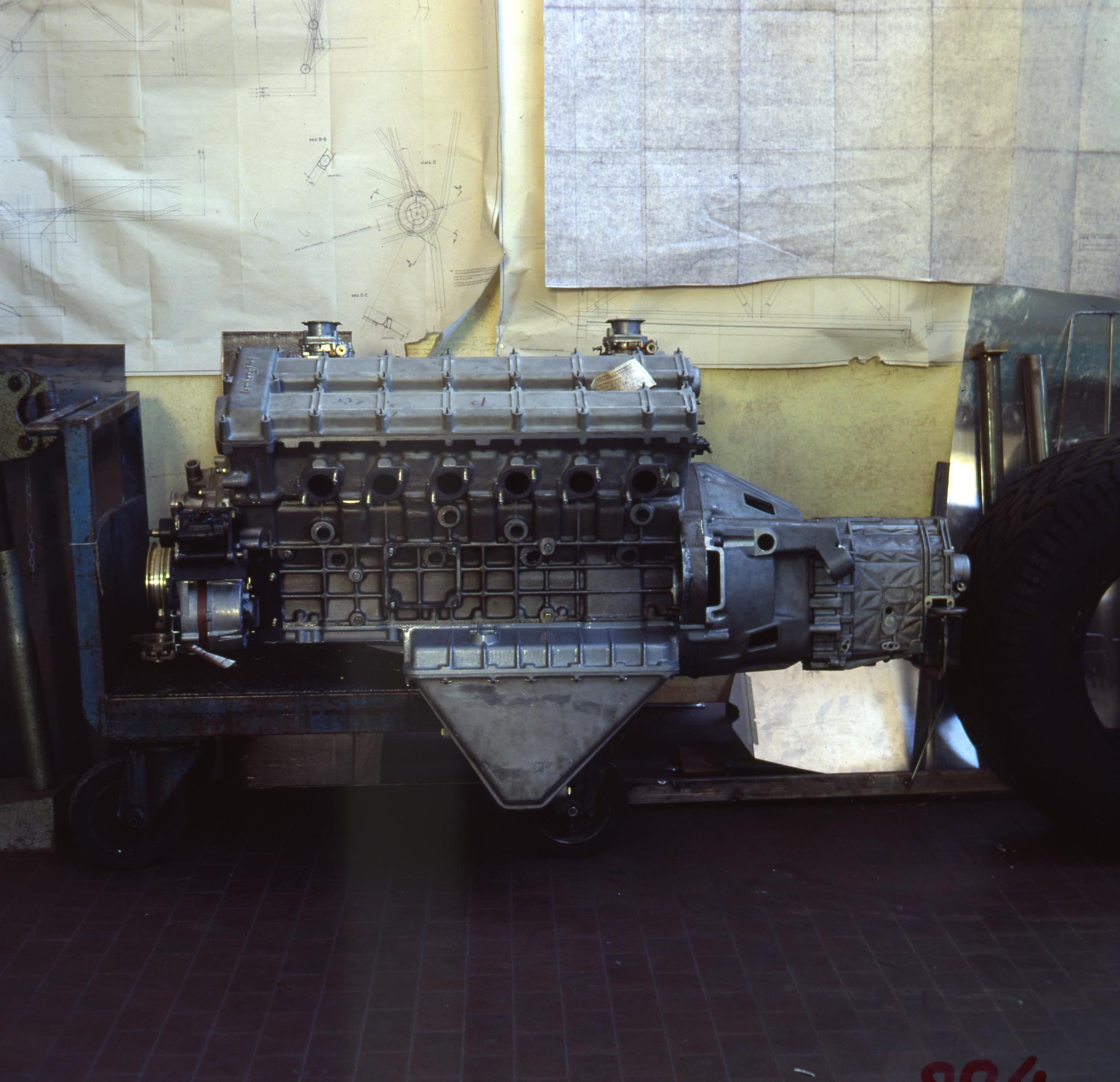 The 'Rambo Lambo' At 40: How Lamborghini'S V12 Off-Roader Invented The Super Suv And Paved The Road To The Urus 5 Complete lamborghini lm002 v12 engine and transmission assembly on a workshop cart