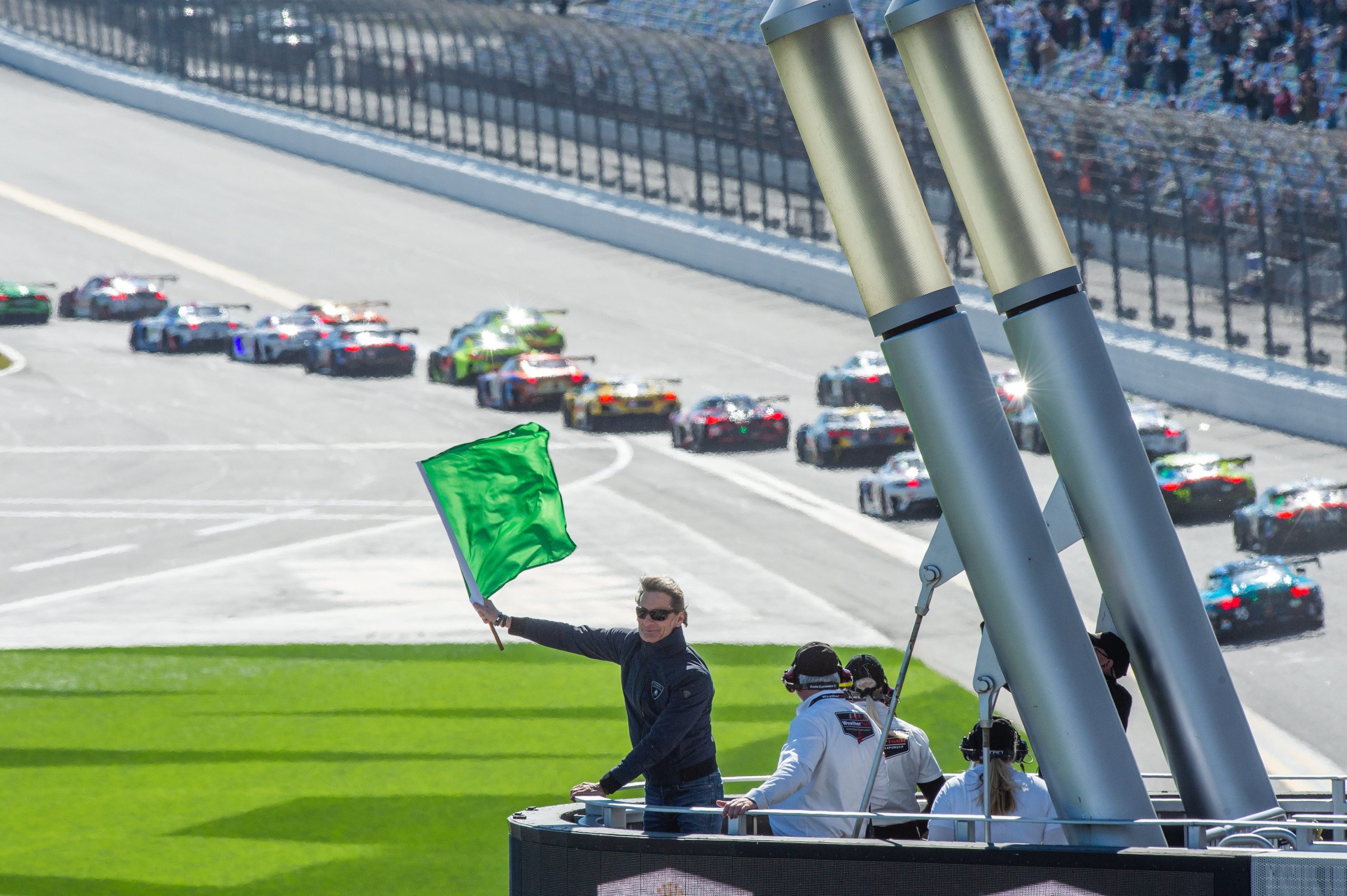 Lamborghini'S Lmdh Gambit: Why The Sc63 Program Is Really About The Road Cars You'Ll Buy Next 3 Aerial view of a race track with a flagman waving a green flag as gt3 cars prepare for action