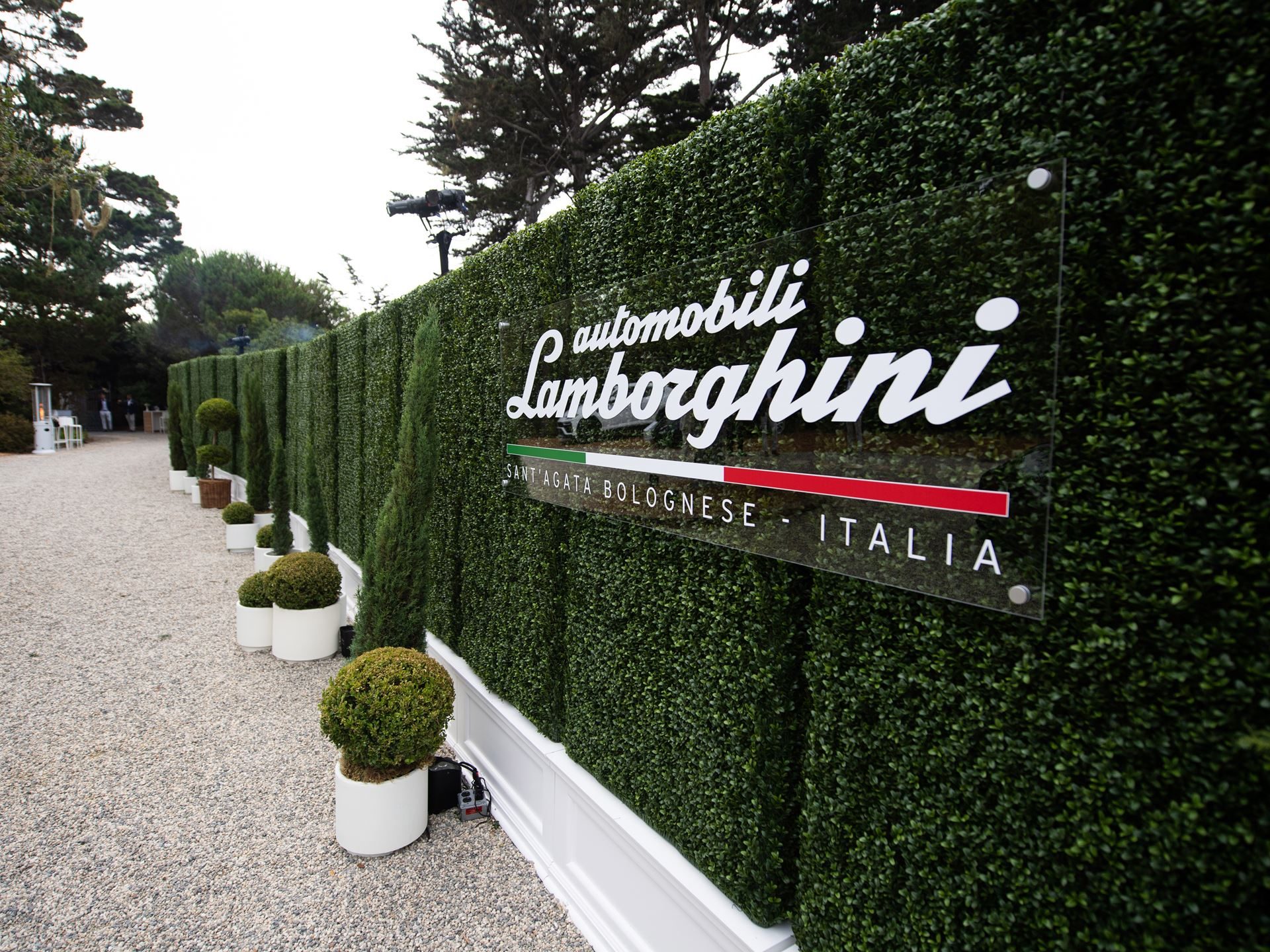 Inside Lamborghini'S Pebble Beach Playbook: How The Lounge Monterey Sells A Lifestyle, Not Just Supercars 5 Automobili lamborghini sant'agata bolognese italia sign on a manicured hedge wall at the lounge monterey entrance