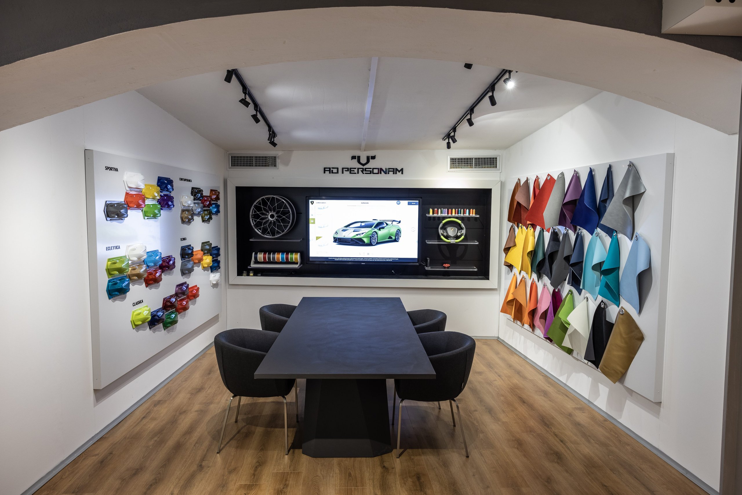 Porto Cervo'S Lamborghini Lounge: Where Ad Personam Meets The Sardinian Coast 5 Ad personam customization studio inside the lamborghini lounge featuring leather swatches, color samples, and a digital configurator showing a green huracán