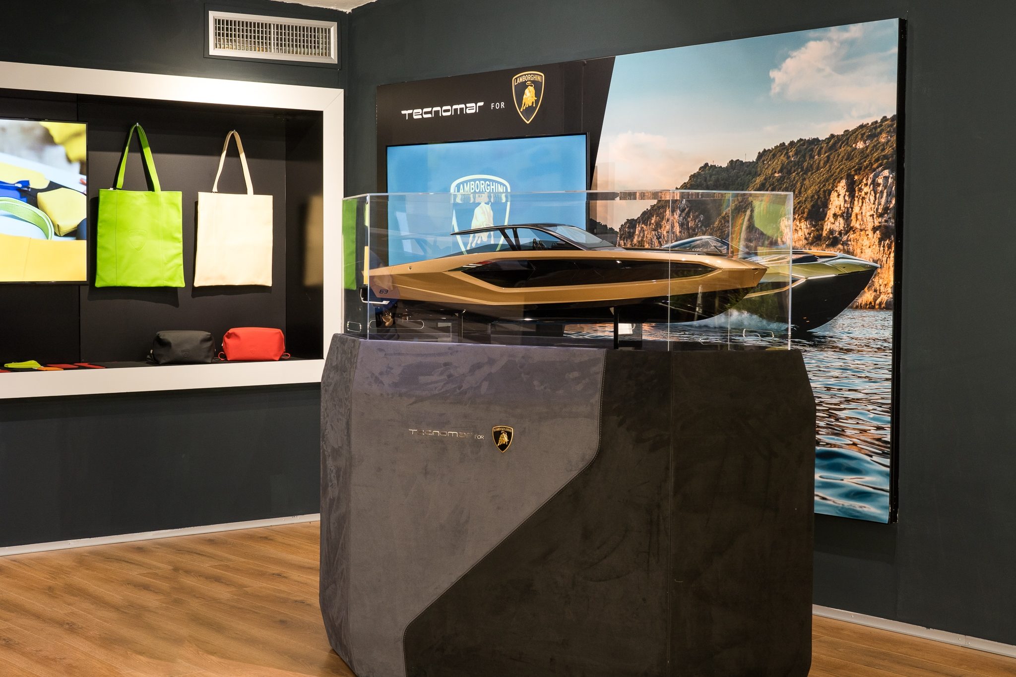 Lamborghini'S Porto Cervo Pop-Up Is A Masterclass In Selling The Supercar Life, Not Just Supercars 11 Scale model of the tecnomar for lamborghini 63 yacht in a display case at the porto cervo lounge