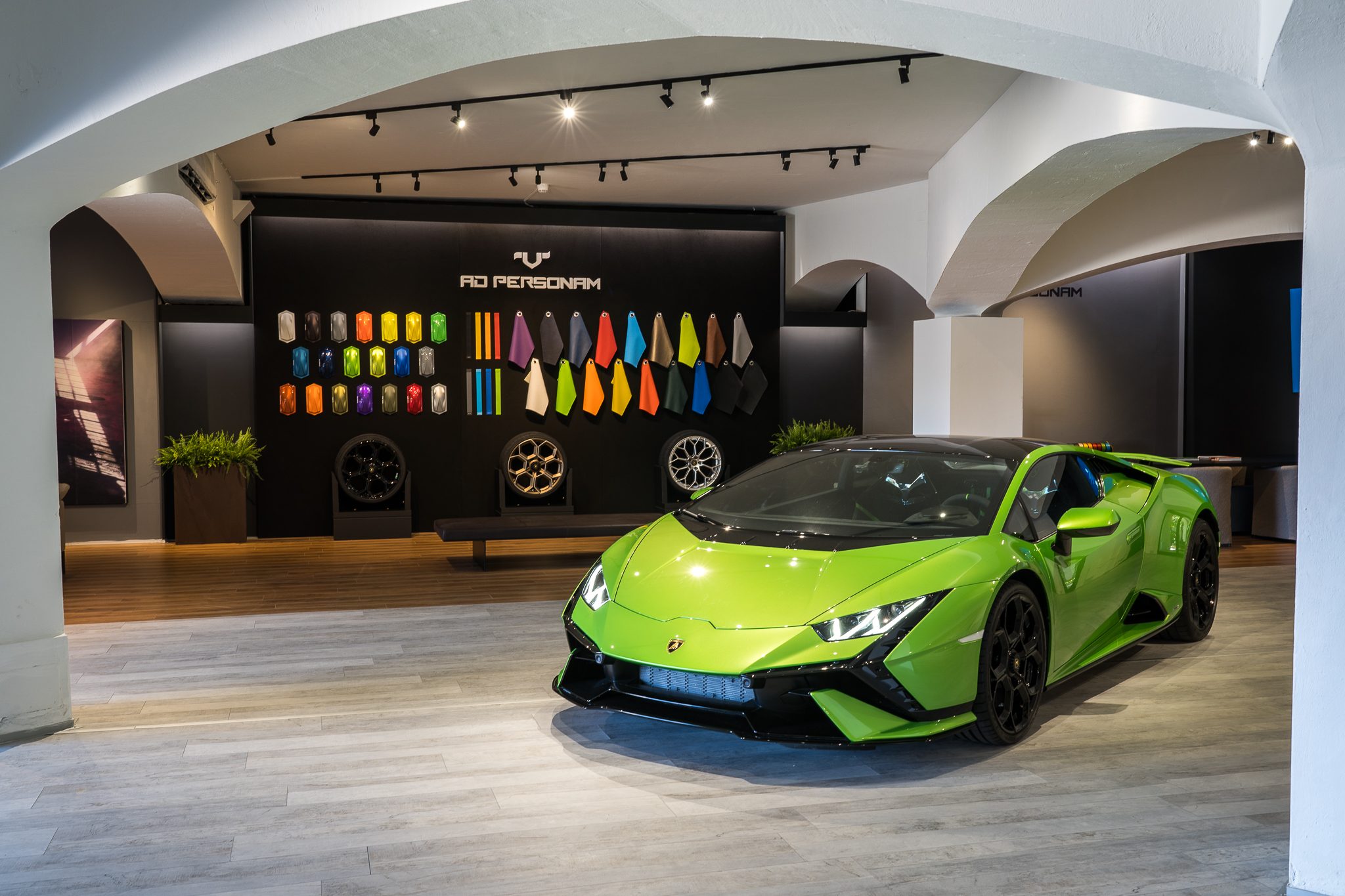 Lamborghini'S Porto Cervo Pop-Up Is A Masterclass In Selling The Supercar Life, Not Just Supercars 9 Green lamborghini huracán tecnica displayed in the porto cervo lounge with ad personam wall visible in background