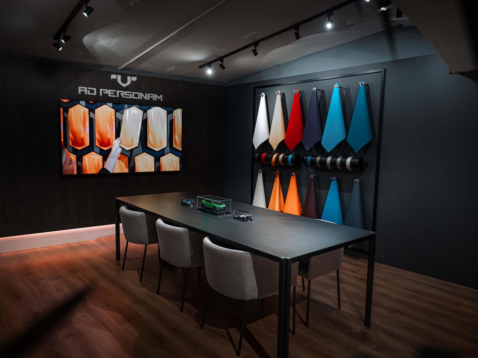 Lamborghini'S Porto Cervo Lounge Returns For A Sixth Summer As A Seaside Brand Hub 7 The ad personam customization room at the lounge porto cervo with a large display screen, conference table, and color and material samples