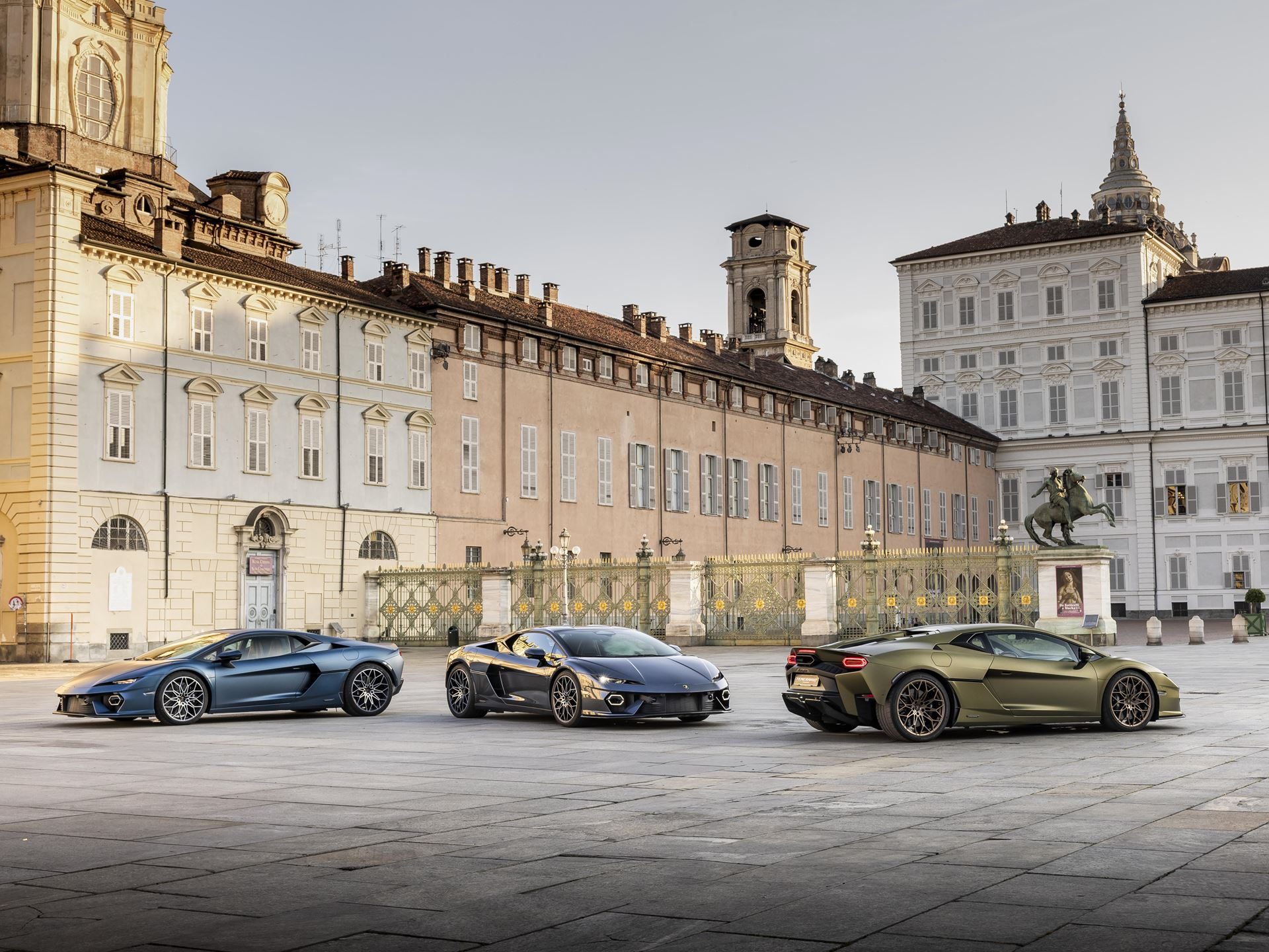 Why Lamborghini'S 'Made In Italy' Day Matters More Than National Pride 11 Three lamborghini supercars including two revueltos and one huracán parked in a grand historic palace square