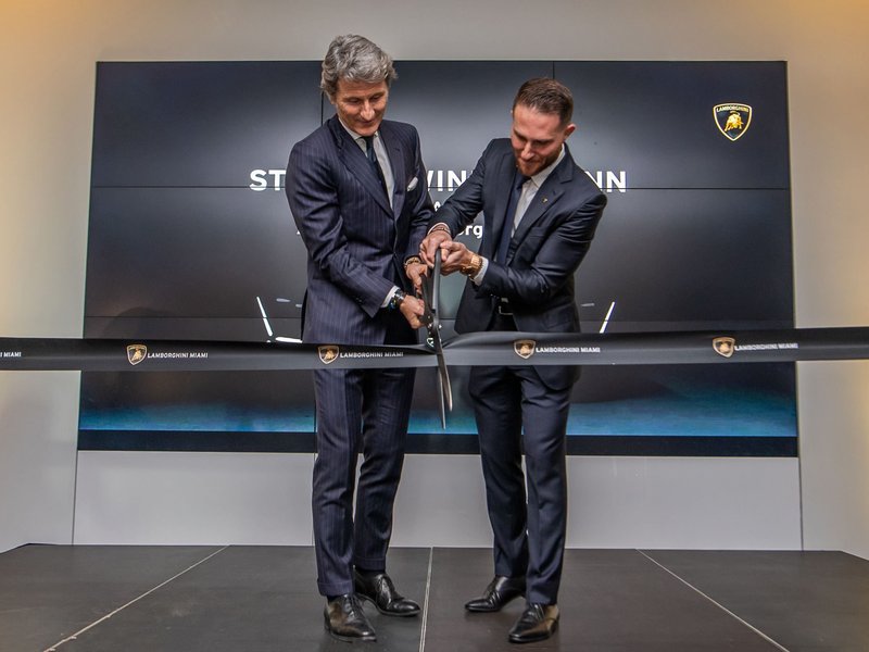 Stephan Winkelmann and Brett David cut the ribbon at the Lamborghini Miami grand reopening event