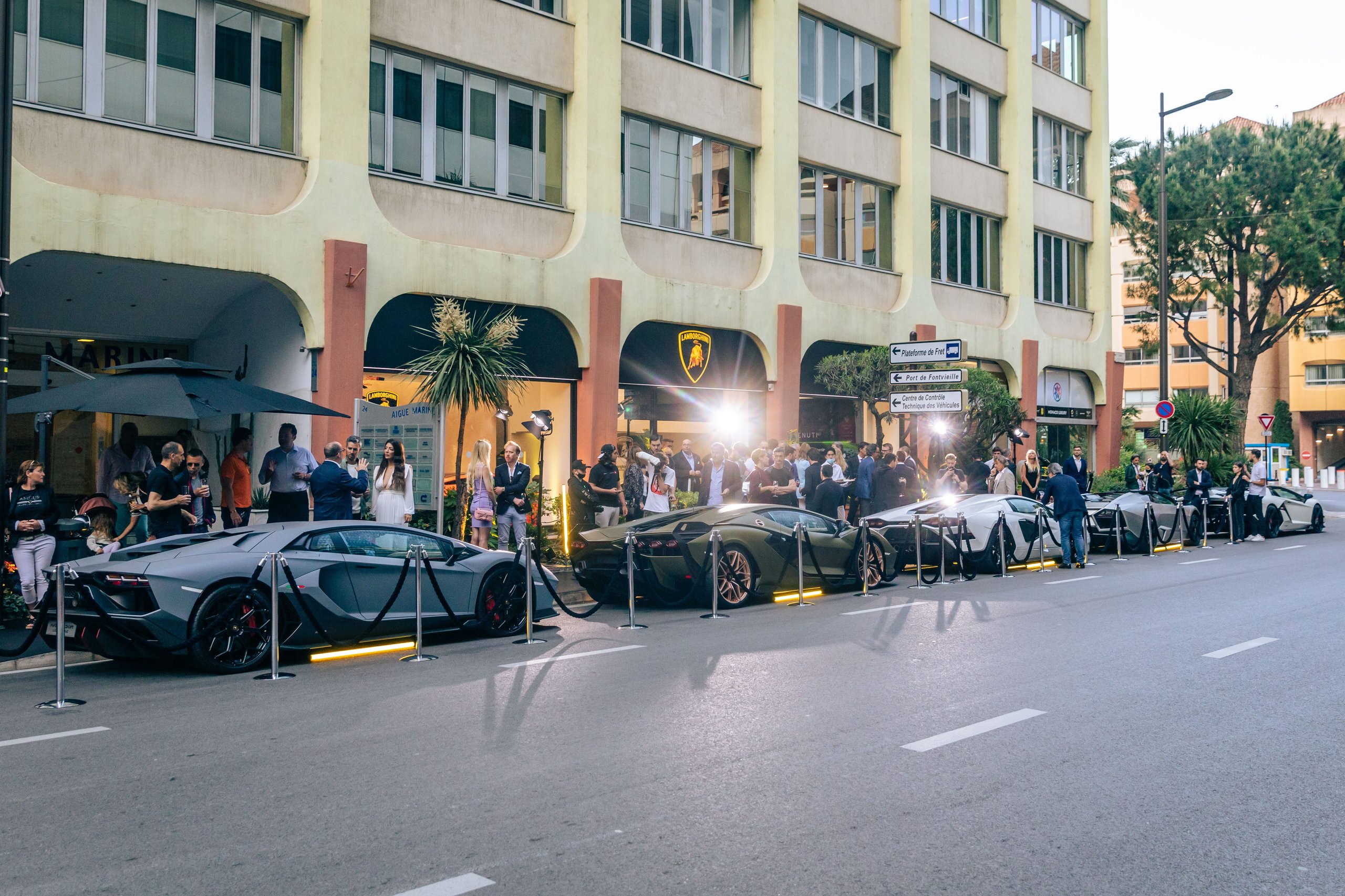 Lamborghini Monaco: How A 218-Square-Meter Showroom Became The Brand'S Riviera Calling Card 9 Line of lamborghini supercars including aventador ultimae and countach lpi 800-4 displayed outside the monaco showroom with guests gathering
