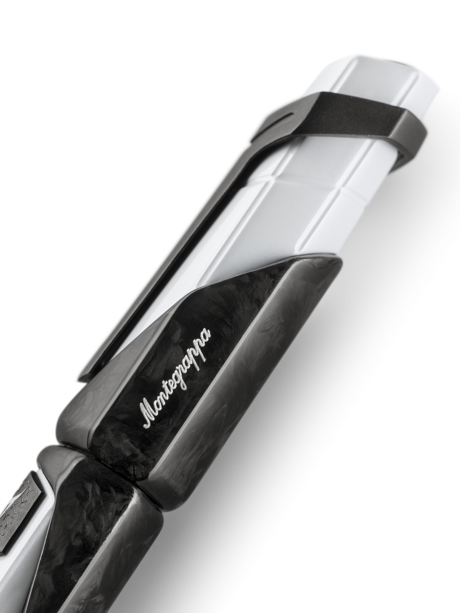Close-up of montegrappa automobili lamborghini 60° pen showing carbon fiber weave on the clip and textured white body detail