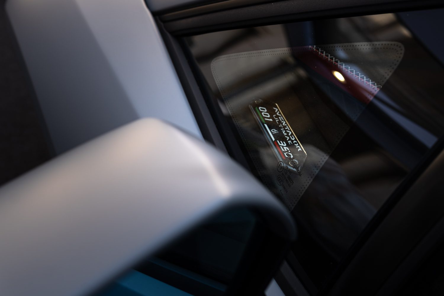 Four Models, Three Executives, One Message: Lamborghini Used Motor Valley Fest 2022 To Map Its Entire Future 3 Close-up of the aventador ultimae badge and production number 001 di 350 visible through the side window