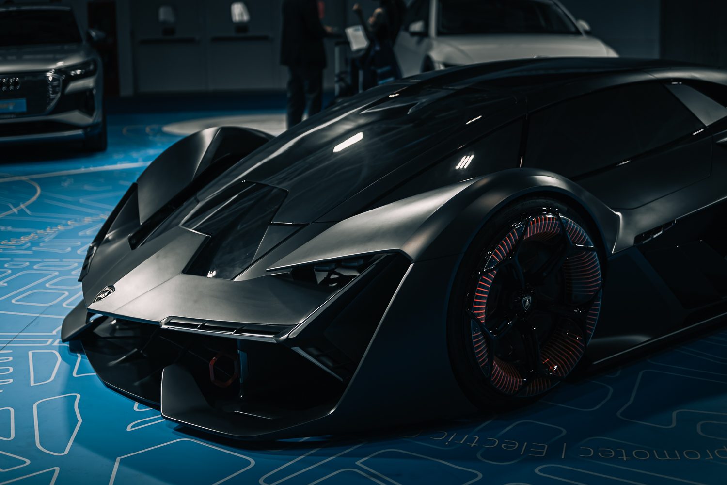 Four Models, Three Executives, One Message: Lamborghini Used Motor Valley Fest 2022 To Map Its Entire Future 5 Close-up of the black lamborghini terzo millennio concept car showing its futuristic design and illuminated orange wheel accents