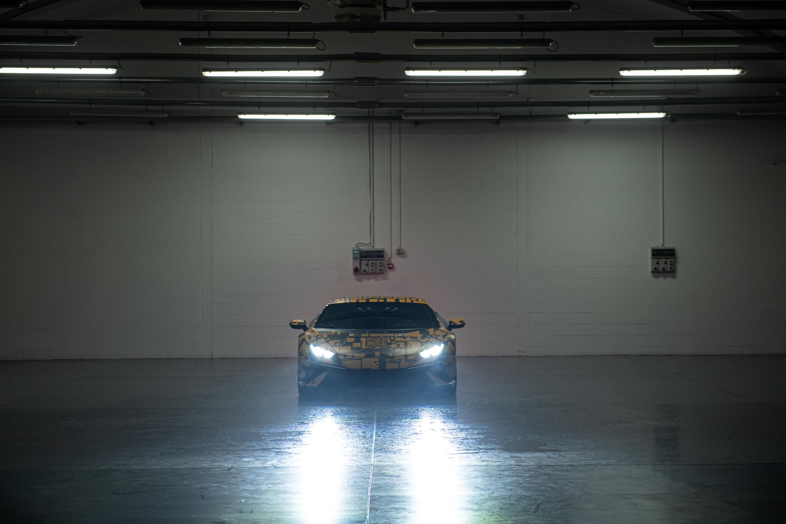 Over 800 Lamborghinis Wear Mustaches For Movember, And Bologna Fc Joins The Parade 9 Black lamborghini huracán with movember yellow and black decal in a dimly lit garage