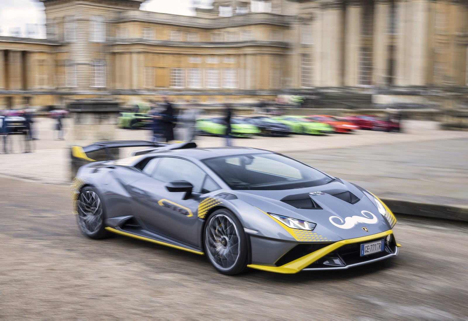 Grey Lamborghini Huracán STO with Movember mustache decal in motion at Blenheim Palace