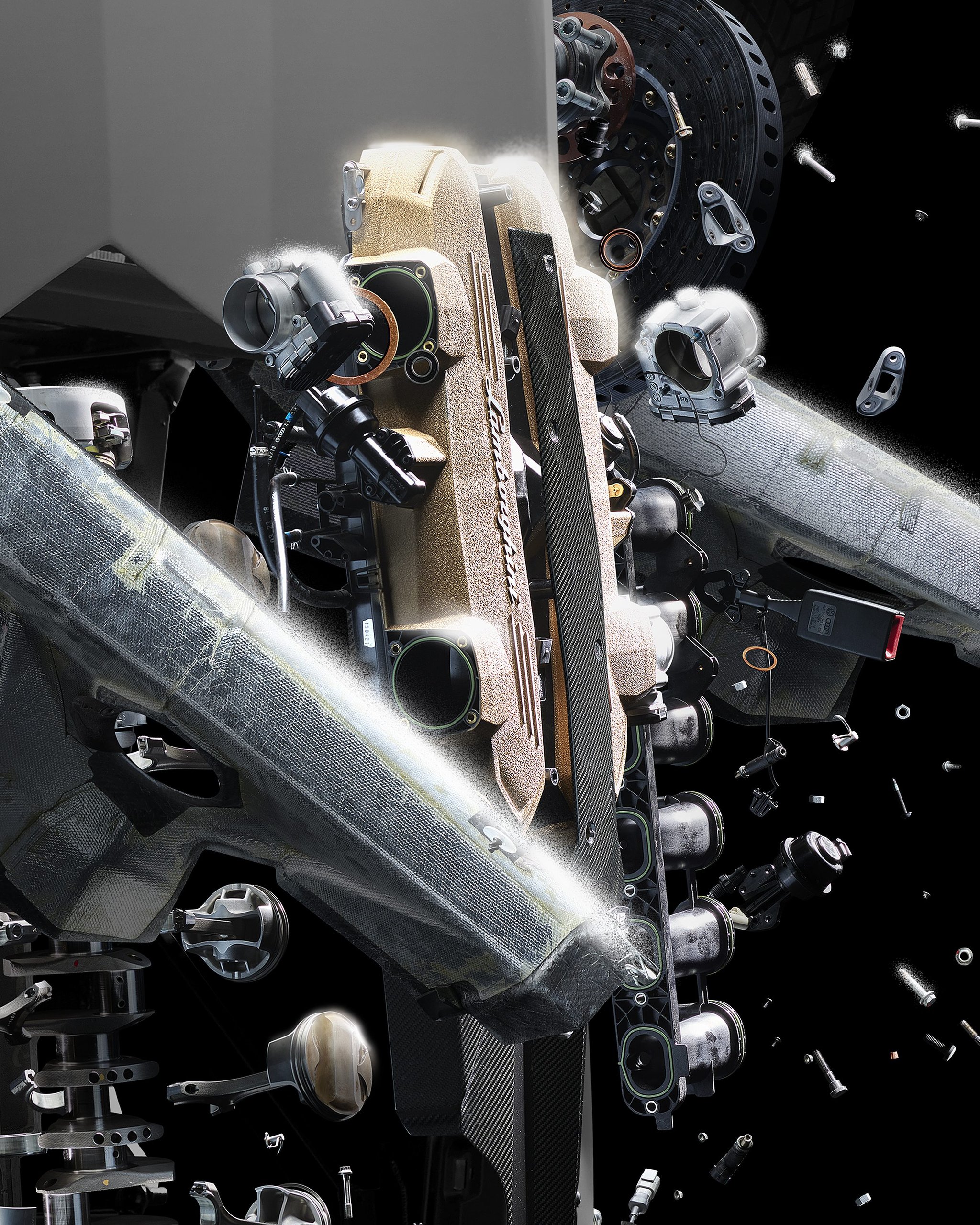 Lamborghini'S 'Space Time Memory' Nft Pairs Iss Carbon Fiber With 600-Million-Pixel Art Of An Exploding Ultimae 5 Exploded view of a lamborghini v12 engine block with gold-colored valve covers and components floating against a black background