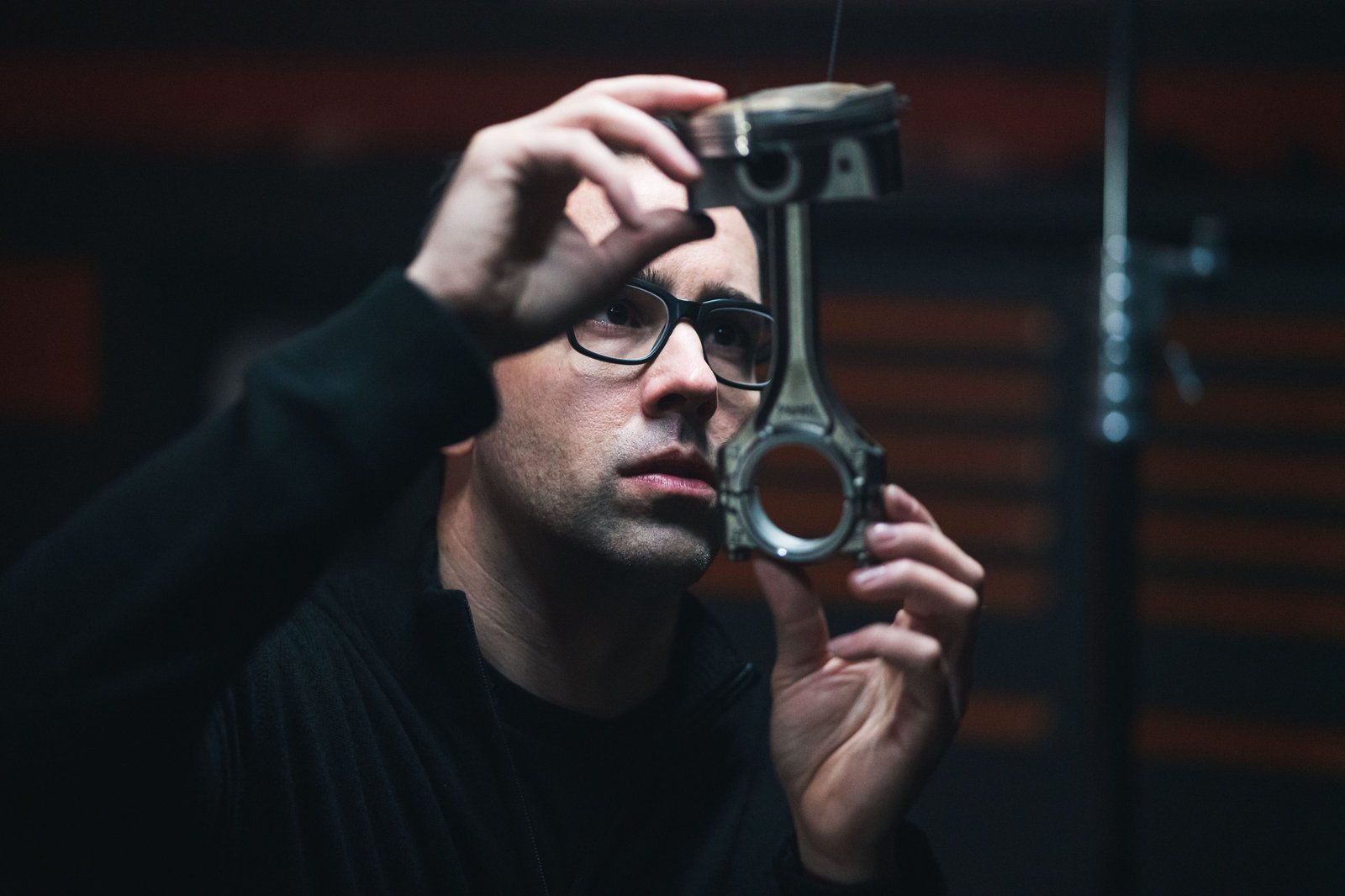 Artist Fabian Oefner examining an Aventador Ultimae engine piston and connecting rod during the creation of Lamborghini's Space Time Memory NFT project