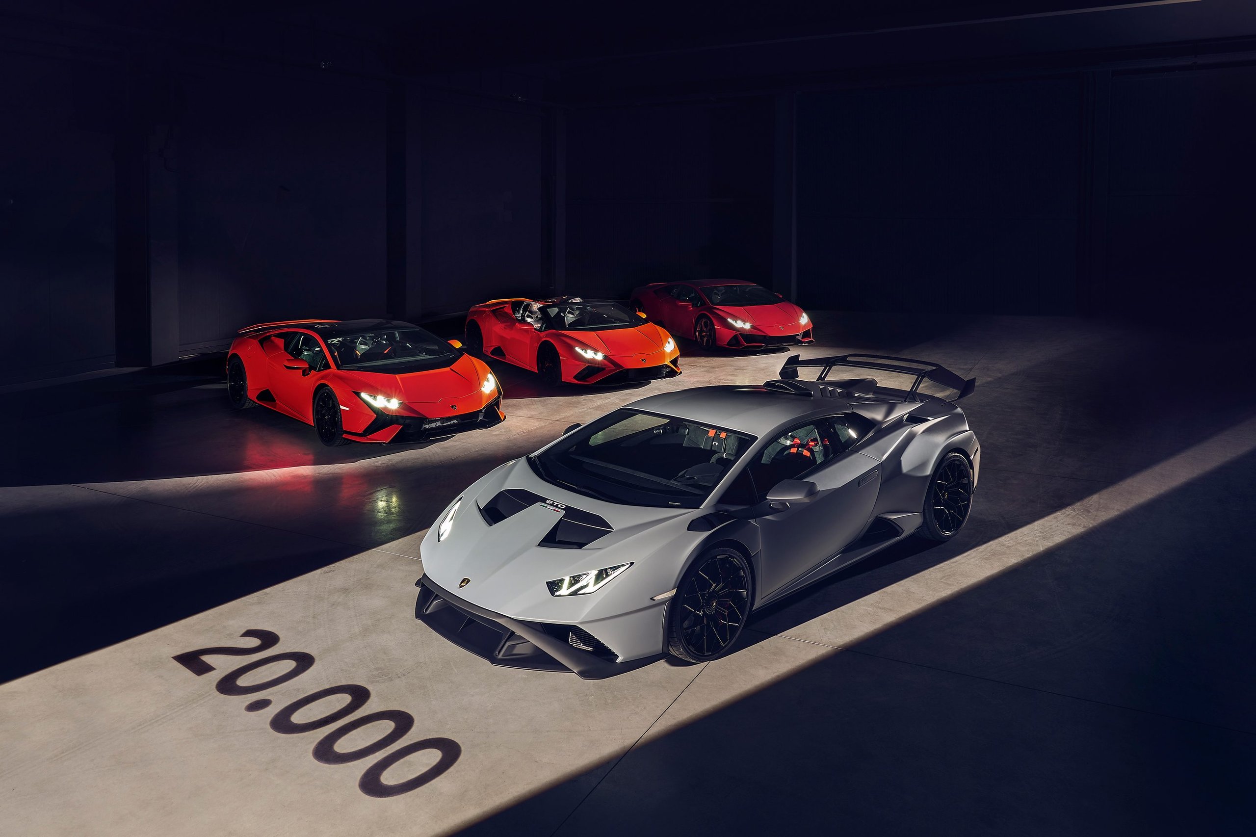 Lamborghini'S Q1 2022 Proves The Power Of Saying No: €178 Million In Profit By Selling Less Than The Market Wants 5 Four lamborghini huracán models in various colors displayed in a studio with 20,000 painted on the floor celebrating the production milestone