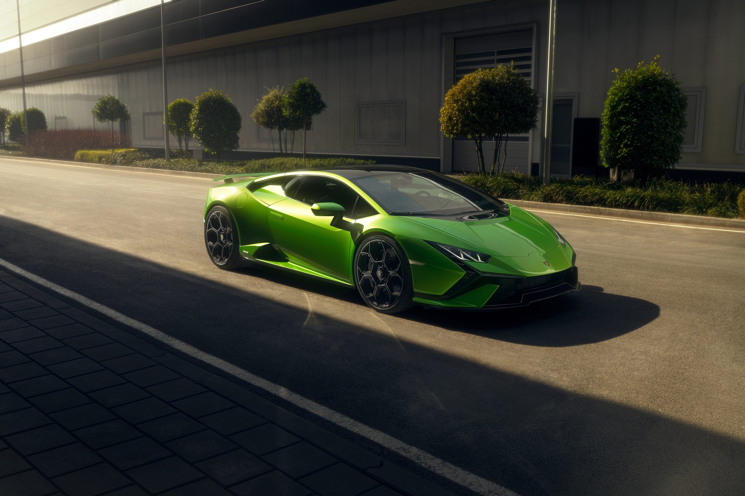 Lamborghini'S 12-Month Backlog Tells The Real Story Behind Its Best Quarter Ever 9 Vibrant green lamborghini huracán tecnica parked on an asphalt road with modern building in background