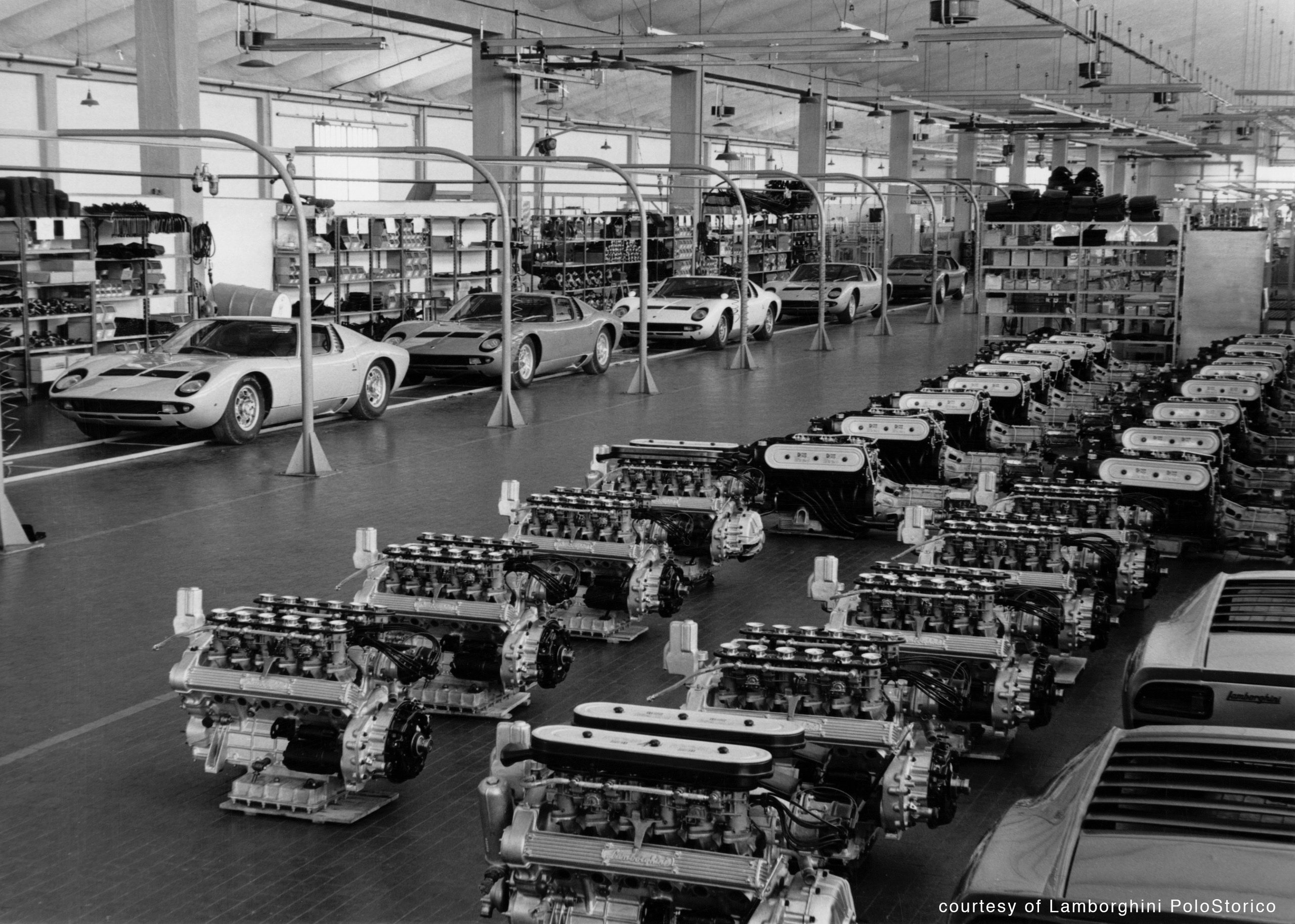 How Five Overlooked Firsts From The Marzal, Miura, Lm002, And Countach Built The Lamborghini You Know Today 5 Black and white photograph of the lamborghini factory floor with miura chassis and v12 engines