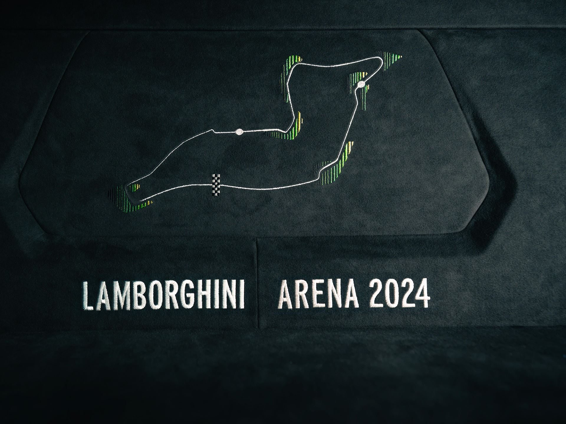 Lamborghini'S Arena Revuelto Turns Ad Personam Into A Competitive Weapon 5 Close-up of embroidered imola circuit map and lamborghini arena 2024 lettering on the revuelto interior bulkhead panel