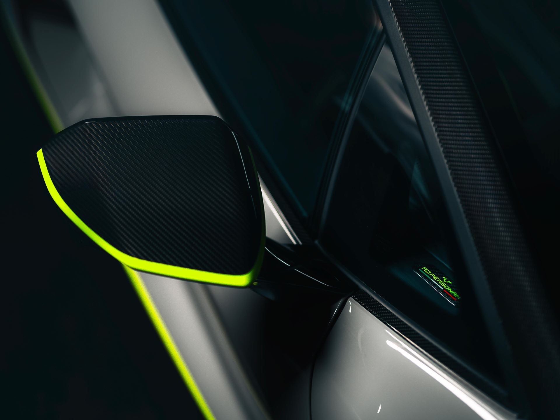 Lamborghini'S Arena Revuelto Turns Ad Personam Into A Competitive Weapon 7 Close-up of carbon fiber side mirror with verde scandal green outline and ad personam badge on the revuelto window