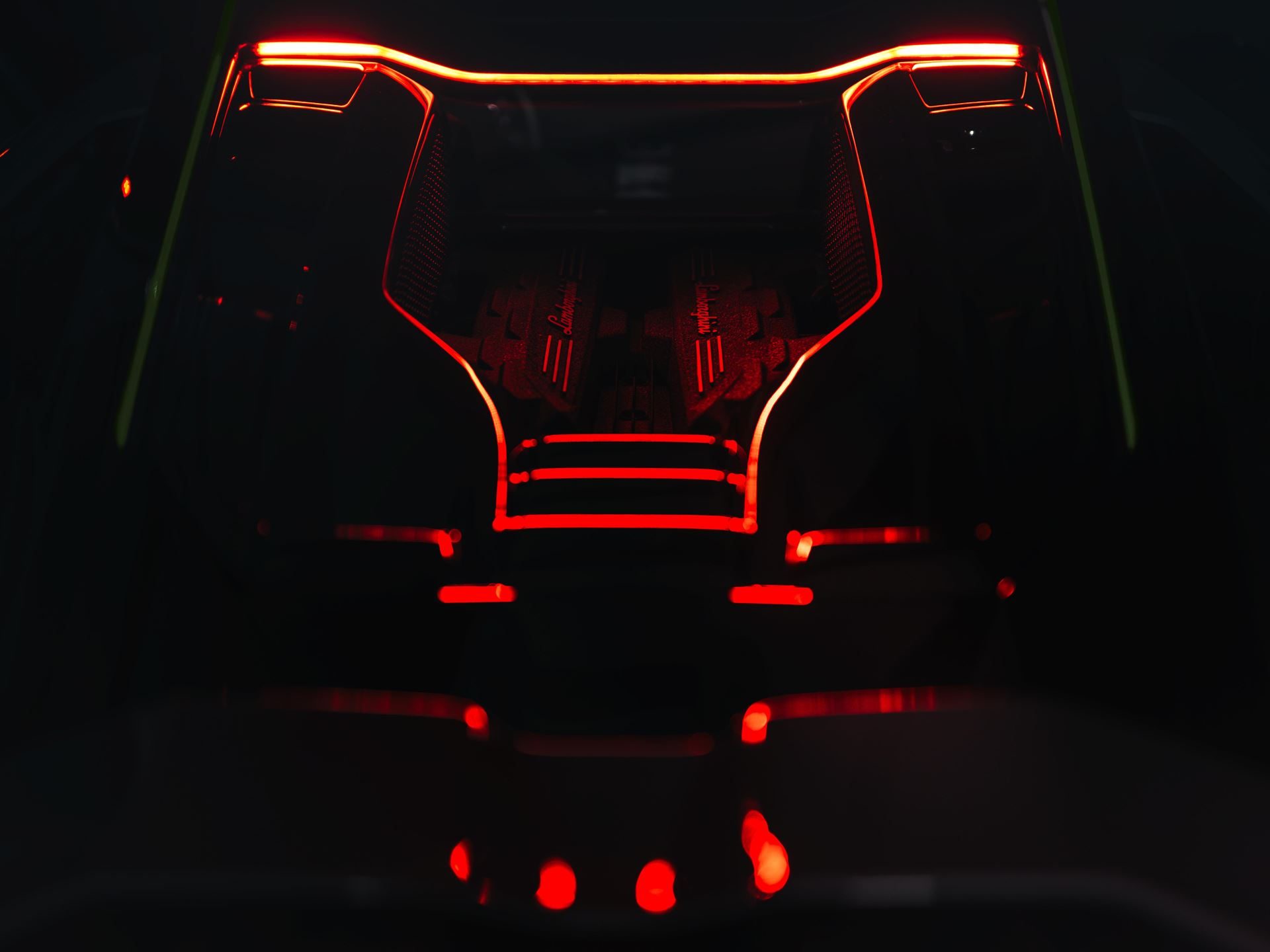 Lamborghini'S Arena Revuelto Turns Ad Personam Into A Competitive Weapon 9 Dramatic dark shot of the lamborghini revuelto v12 engine bay with red accent lighting