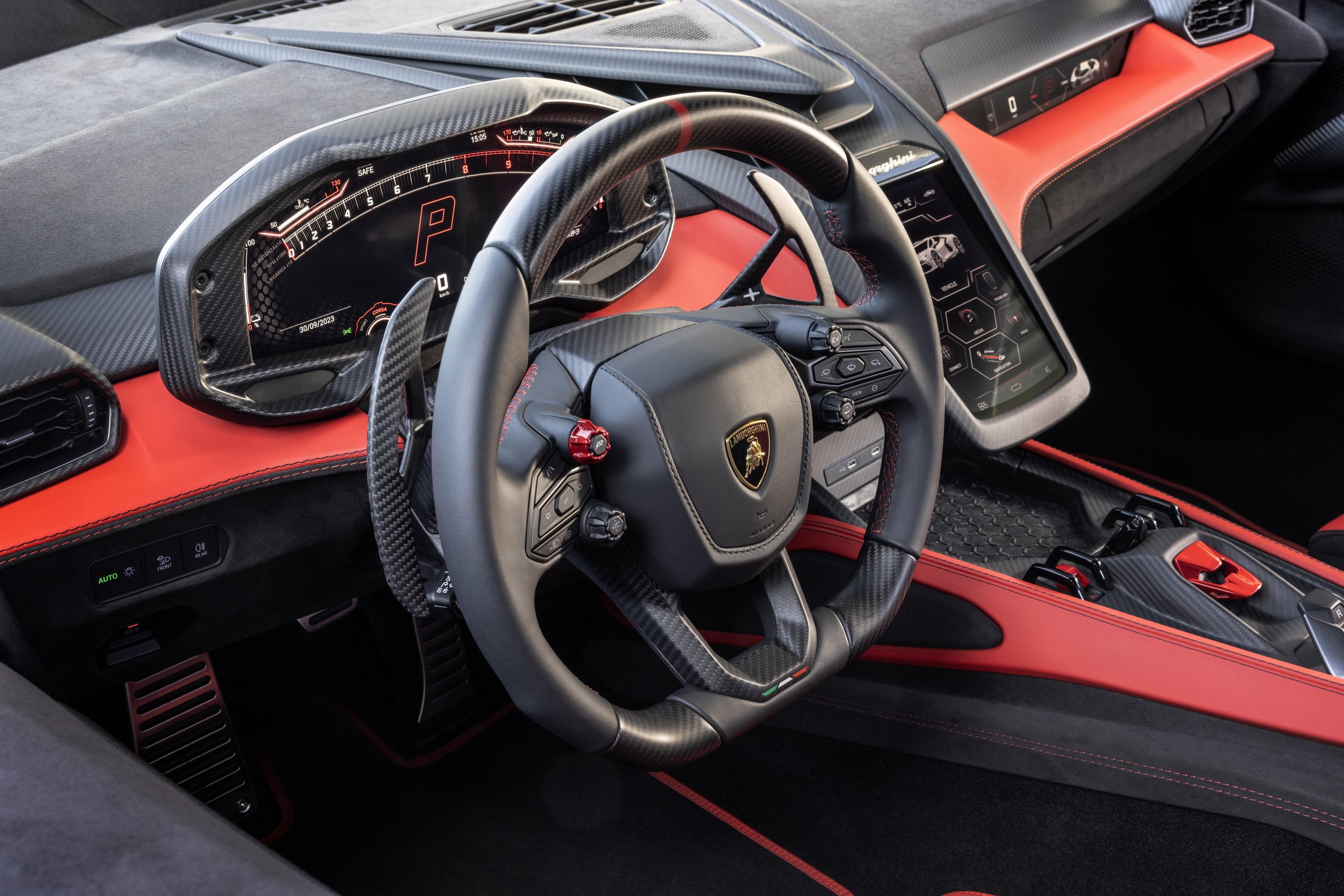 Lamborghini Sent The Revuelto Across Italy To Prove A 1,001 Hp Hybrid Can Still Be A Proper V12 Flagship 13 Detailed shot of the revuelto steering wheel and dashboard with digital displays, hexagonal motifs, and carbon fiber trim