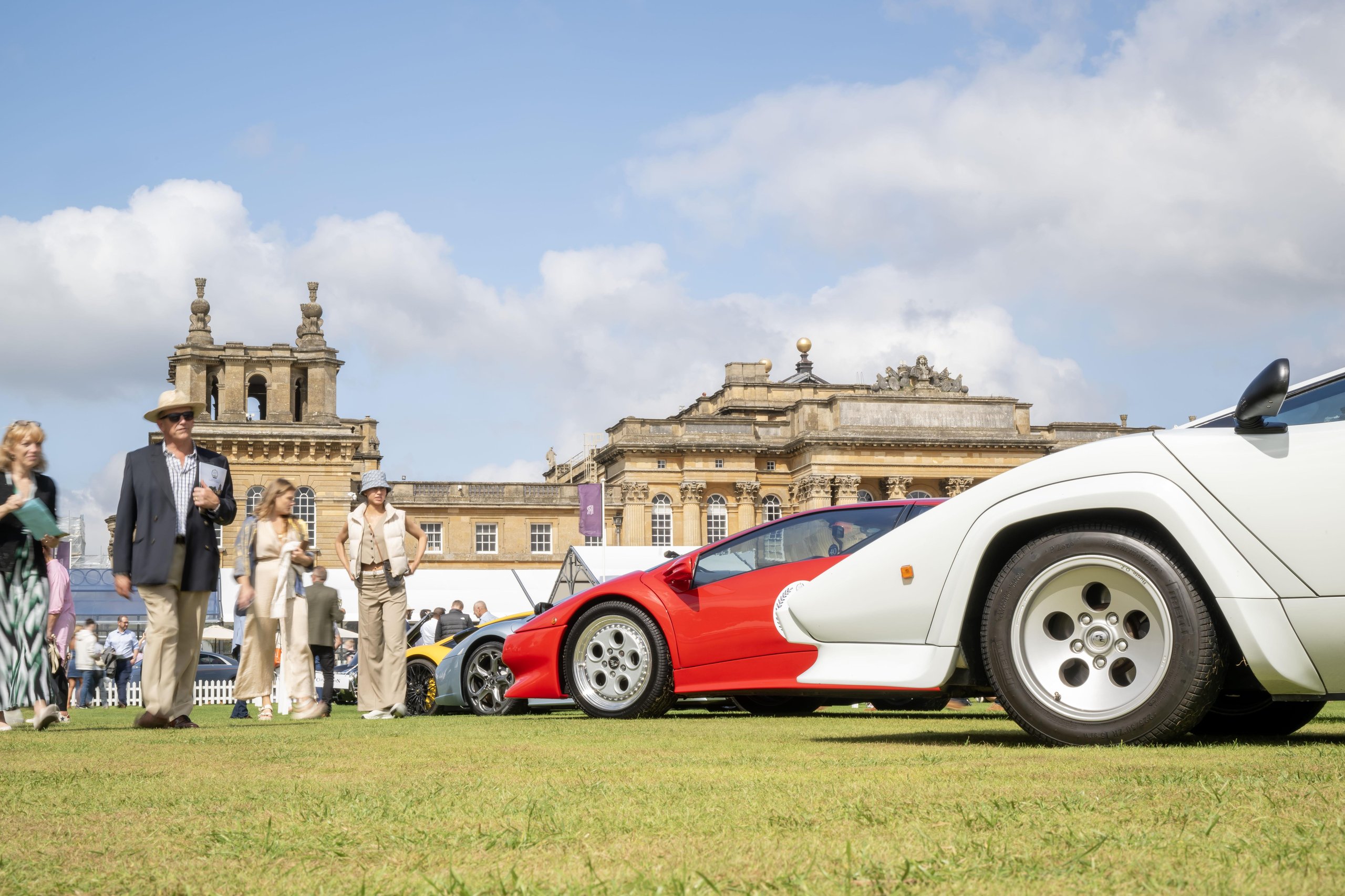 Sixty V12 Lamborghinis At Blenheim Palace: How Salon Privé Became The Revuelto'S Most Strategic Uk Stage 9 A line of classic lamborghini supercars including a white countach and red diablo on the grass at blenheim palace