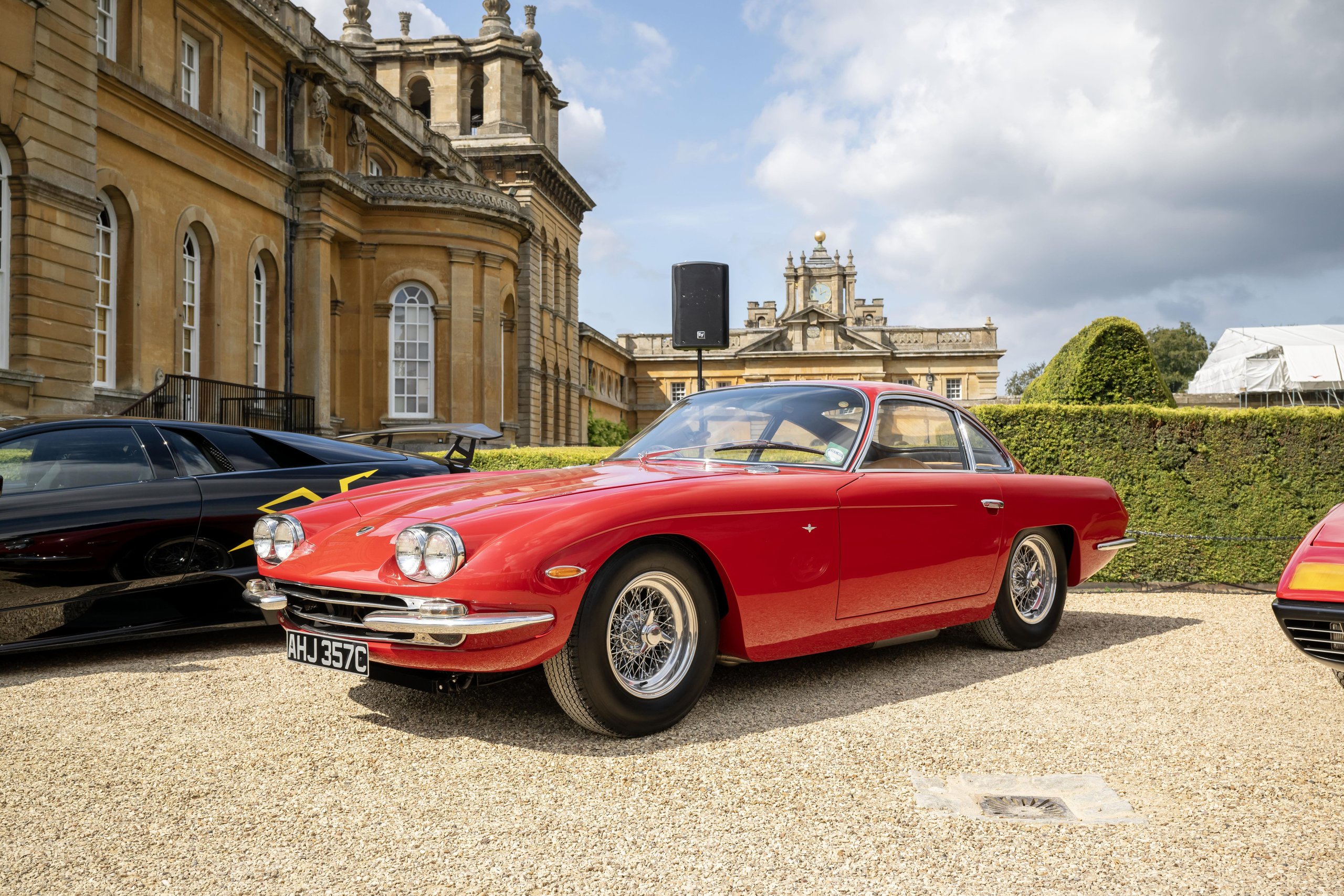 Sixty V12 Lamborghinis At Blenheim Palace: How Salon Privé Became The Revuelto'S Most Strategic Uk Stage 5 A red lamborghini 400 gt 2+2 parked on a gravel driveway in front of blenheim palace