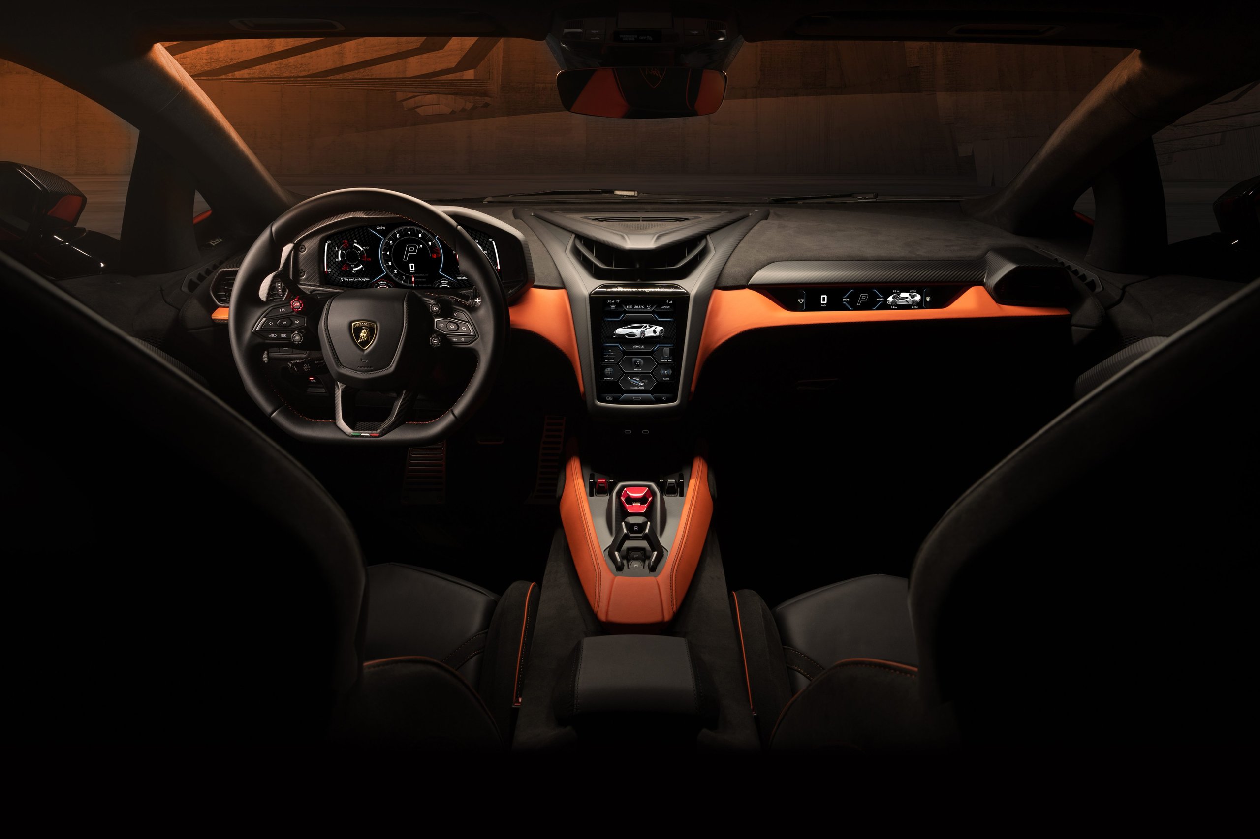 Lamborghini Revuelto: How Three Electric Motors Saved The V12 From Extinction 7 Wide symmetrical interior shot of the lamborghini revuelto cockpit showing digital displays, y-motif elements, and orange accents