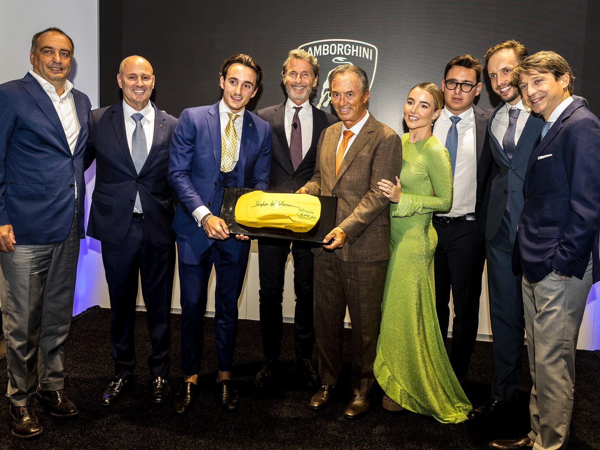 Lamborghini San Antonio Opens As A 40,000-Square-Foot Stage For The Temerario'S Market Debut 7 Lamborghini executives and vips posing with a golden plaque at the san antonio grand opening ceremony
