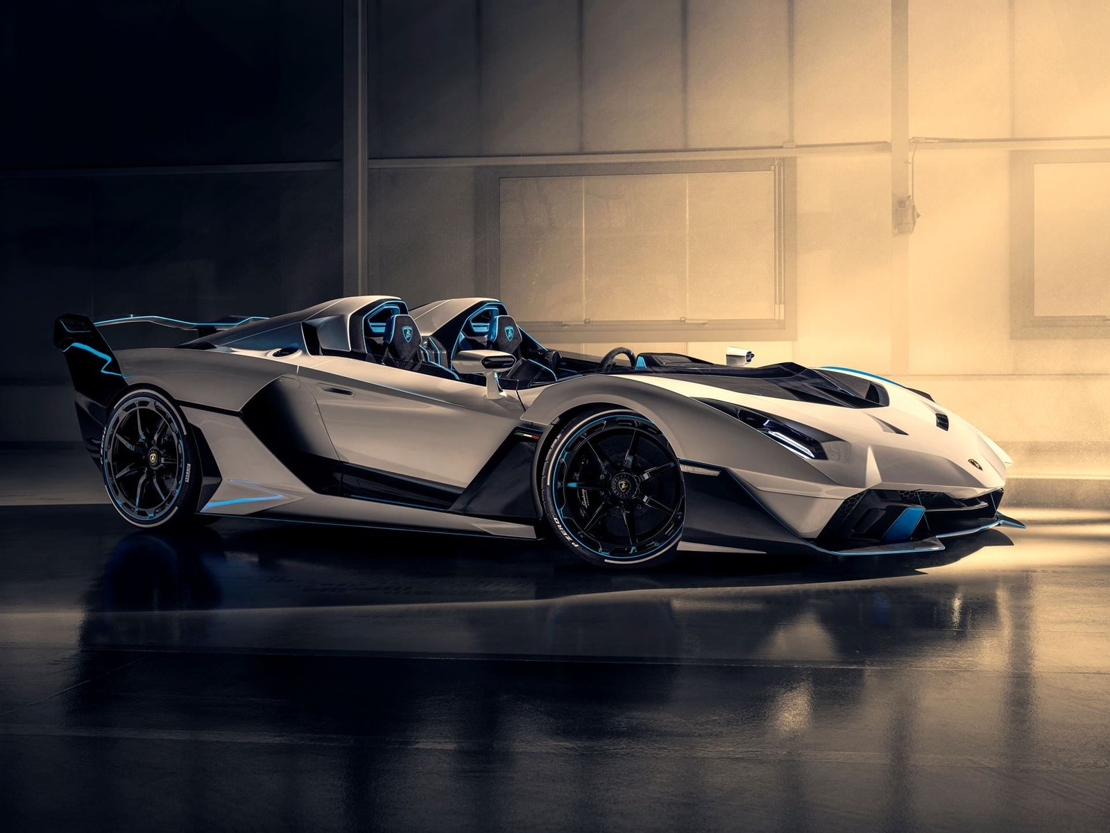 Lamborghini SC20 one-off open-top V12 track car in Bianco Fu with Blu Cepheus livery, side profile in studio