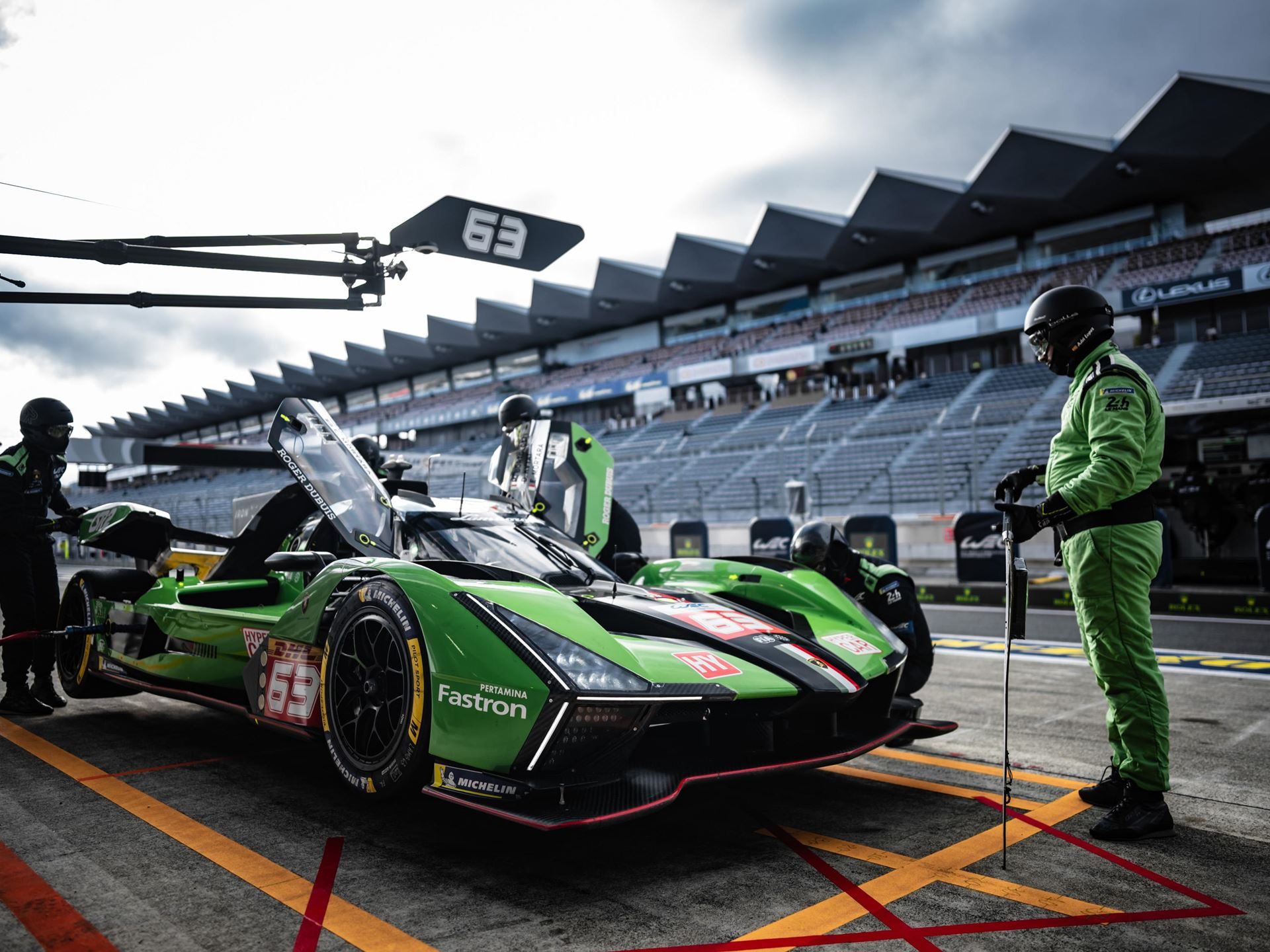 Lamborghini Sc63 Earns First Hyperpole At Fuji, Then A Drivetrain Failure Ends The Story Early 9 Lamborghini sc63 in the pit lane at fuji speedway surrounded by crew members with empty grandstands in the background
