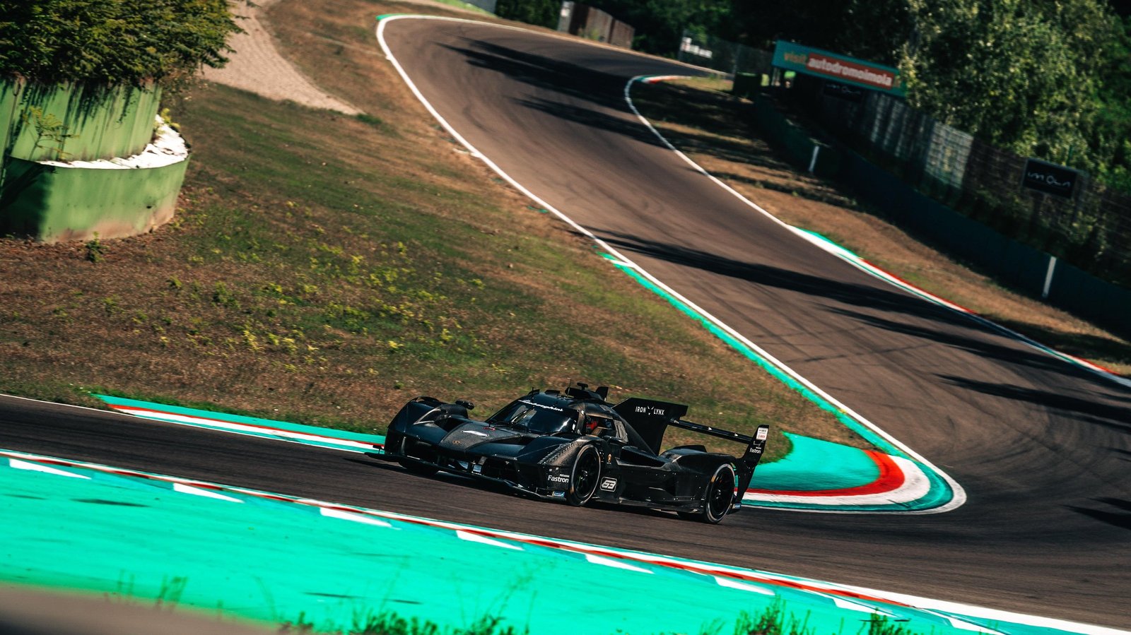 Lamborghini SC63 LMDh prototype navigating a sweeping turn during its first track test at Imola in August 2023
