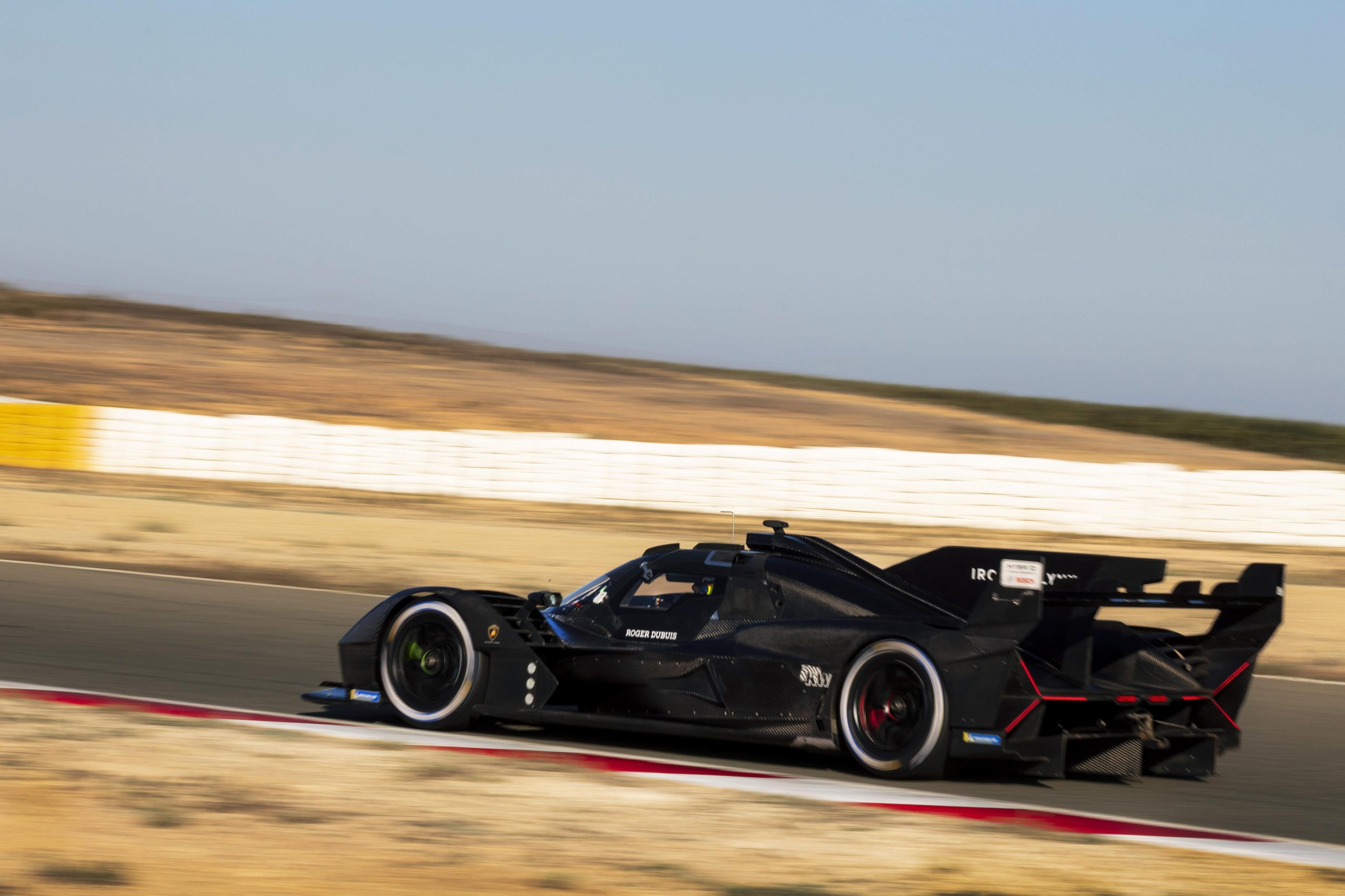 The Sc63 Lmdh Looked Like Lamborghini'S Future. Then The Future Changed. 5 Lamborghini sc63 at speed on track showing its large rear wing and red accent lighting