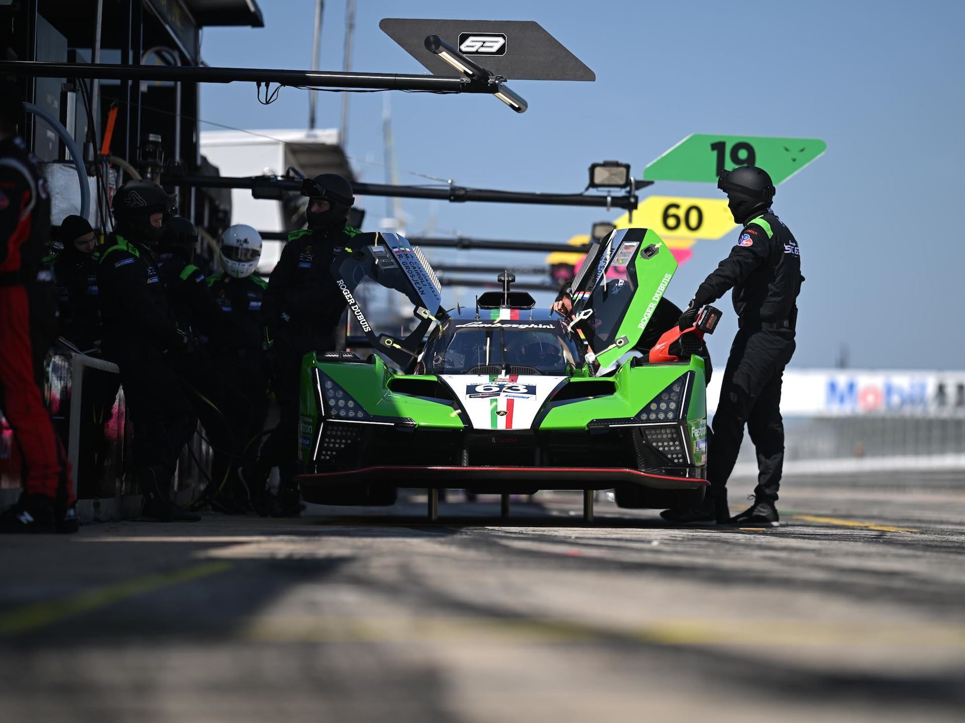 Lamborghini'S Sc63 Lmdh Arrives At Sebring To Learn, Not To Win 3 Lamborghini sc63 in the pit lane surrounded by iron lynx pit crew during a race event