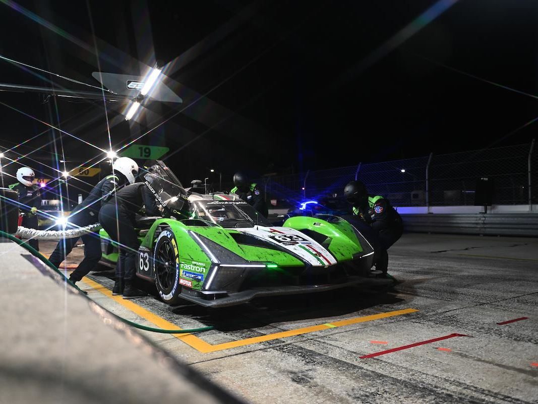 The Sc63'S Sebring Seventh: Why Finishing On The Lead Lap Mattered More Than The Position 5 The lamborghini sc63 during a night pit stop at sebring surrounded by pit crew under bright lights