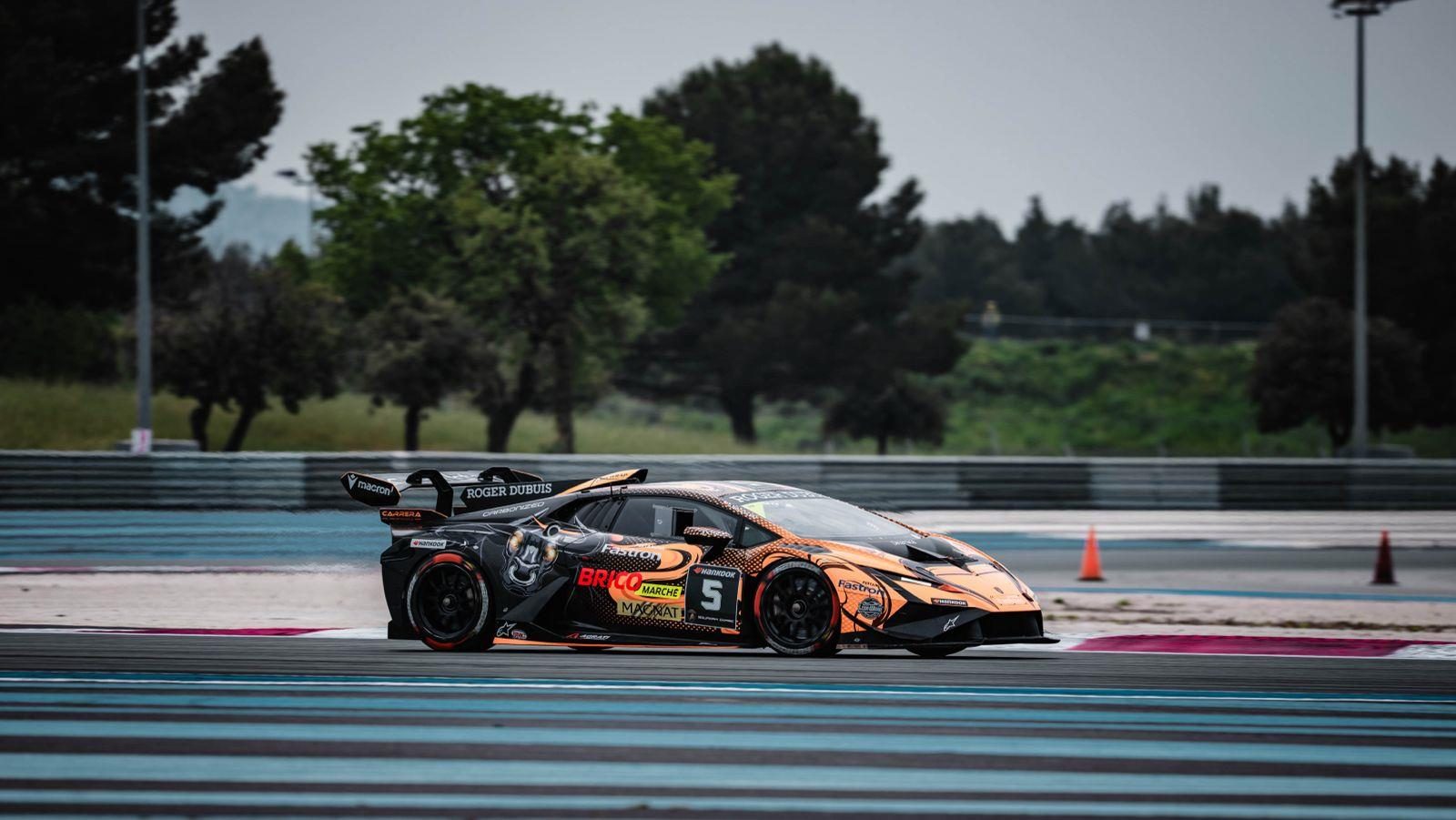 37 Cars, Four Titles Separated By Single Points: Lamborghini Super Trofeo Europe Hits Spa At The Boiling Point 9 Orange and black lamborghini huracán super trofeo evo2 race car driving on a racetrack under overcast skies