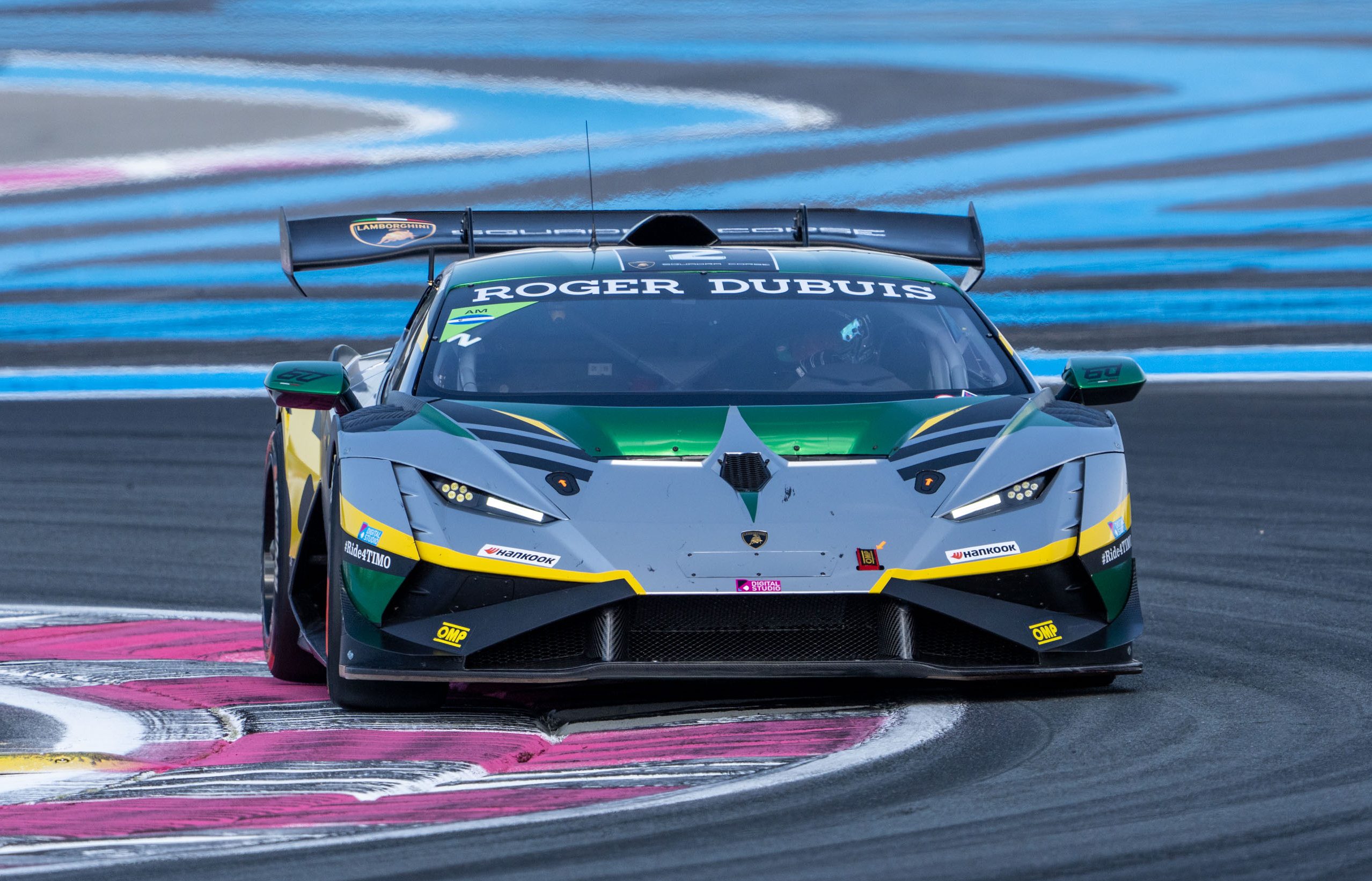49 Huracán Evo2S At Spa: Lamborghini'S One-Make Series Celebrates 60 Years Where It All Began 9 Grey, green, and yellow lamborghini huracán super trofeo evo2 approaching head-on through a turn with blue and white track markings