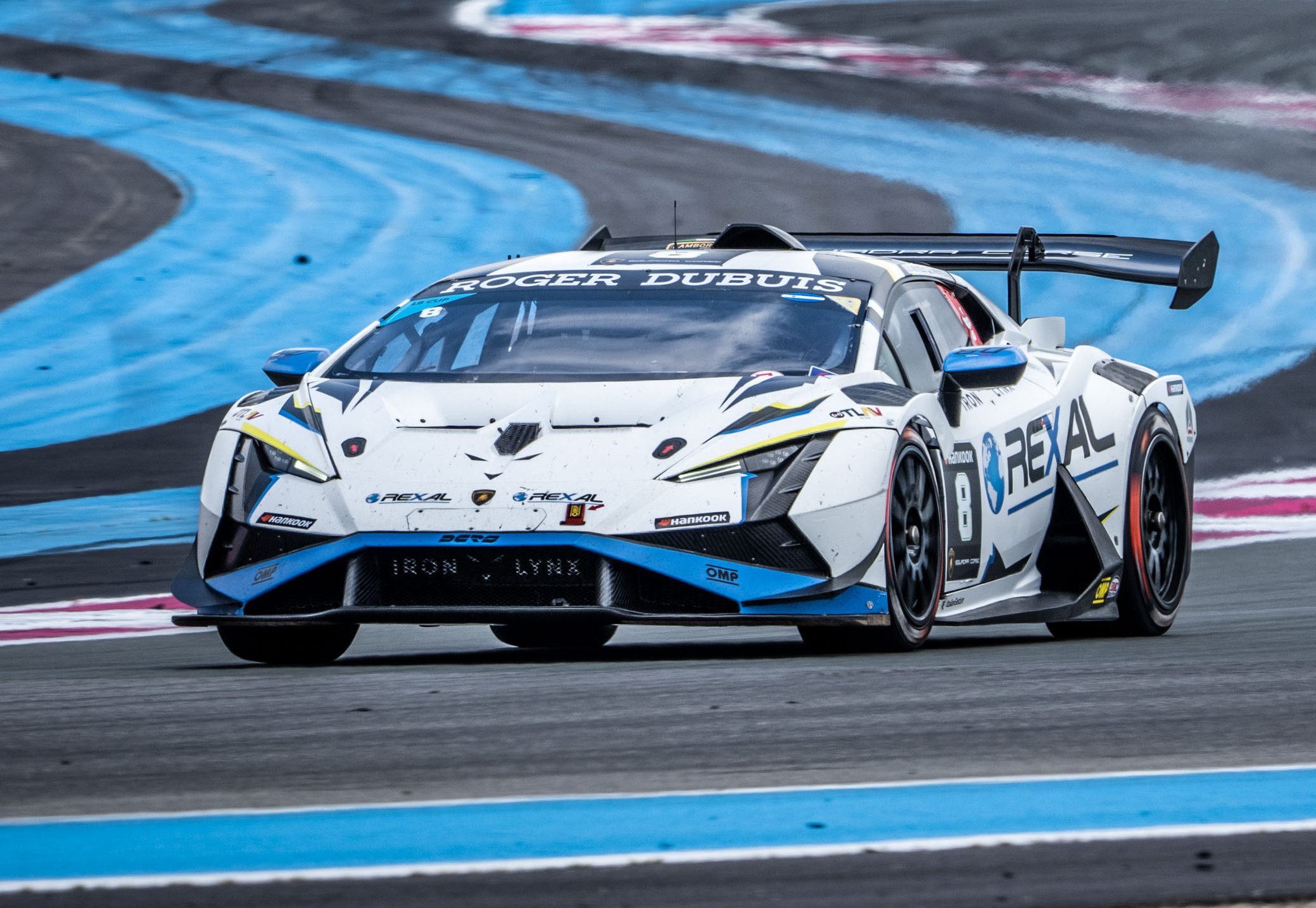 49 Huracán Evo2S At Spa: Lamborghini'S One-Make Series Celebrates 60 Years Where It All Began 11 White and blue lamborghini huracán super trofeo evo2 in motion on track with blue and white kerb markings