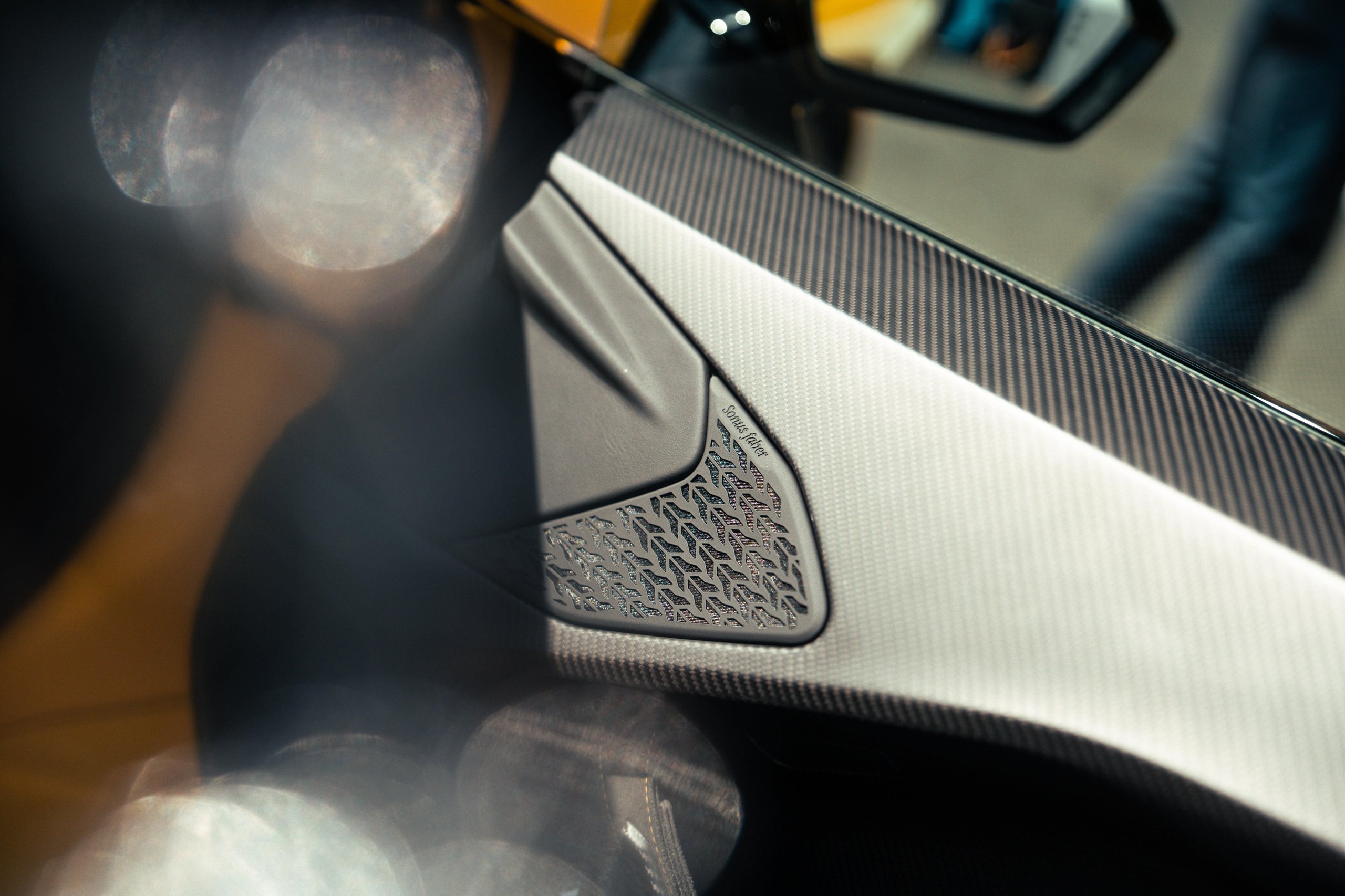 Fifteen Days At Estoril: What Lamborghini'S Temerario Launch Reveals About Its Hybrid Ambitions 9 Close-up of carbon fiber interior panel with sonus faber speaker grille inside the lamborghini temerario