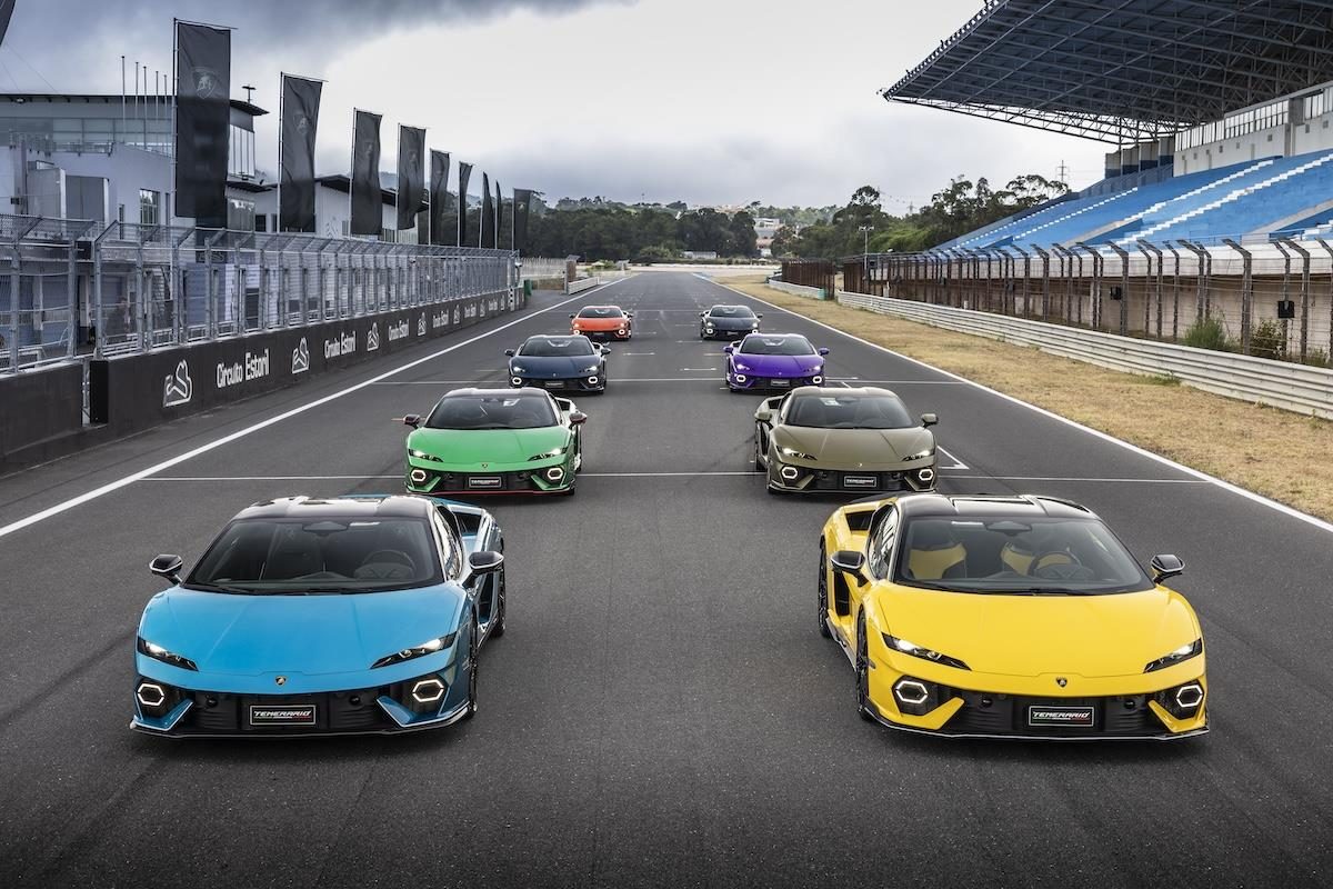 Fifteen Days At Estoril: What Lamborghini'S Temerario Launch Reveals About Its Hybrid Ambitions 3 Multiple lamborghini temerario cars in various colors lined up on the estoril race track with a grandstand in the background