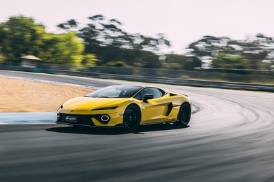 Fifteen Days At Estoril: What Lamborghini'S Temerario Launch Reveals About Its Hybrid Ambitions 2 Yellow lamborghini temerario speeding through a corner at the estoril circuit with motion blur