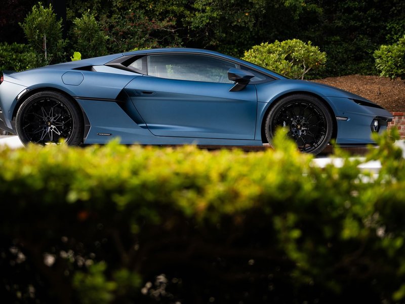 Matte blue Lamborghini Temerario in side profile at Monterey Car Week 2024