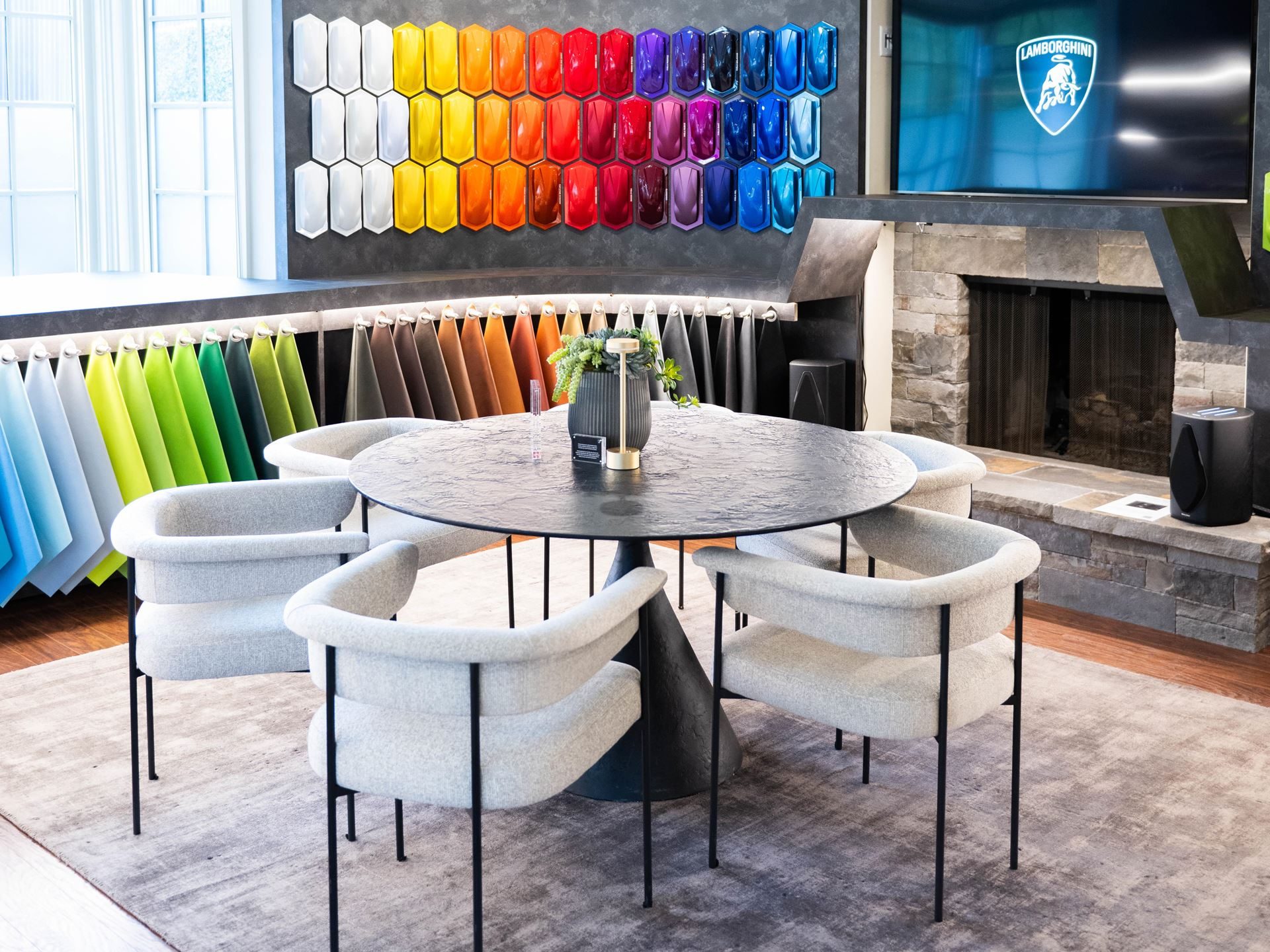 Lamborghini Staged Its Hybrid Future Around The Temerario At Monterey Car Week 9 Interior of lamborghini ad personam studio with paint and material swatches displayed on the walls