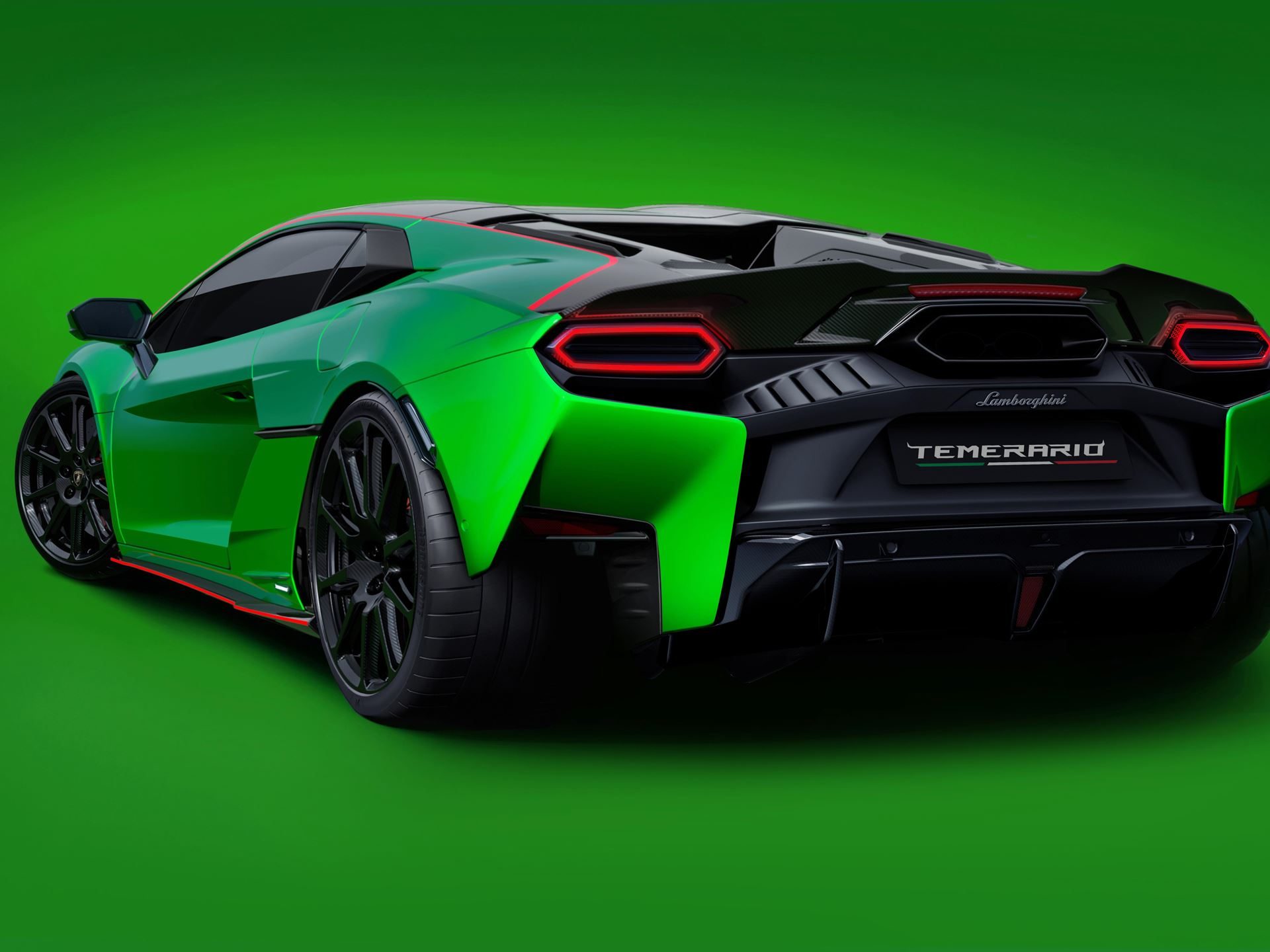 Rear three-quarter view of the green lamborghini temerario showing hexagonal taillights, rear diffuser, and temerario badging