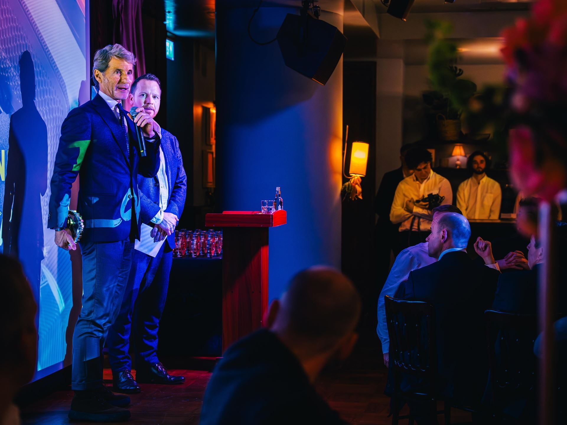 Stephan winkelmann speaks on stage at the topgear. Com awards 2023 event while holding the award