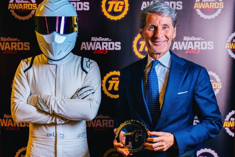 Stephan Winkelmann, CEO of Lamborghini, poses with The Stig holding the TopGear.com Manufacturer of the Year trophy