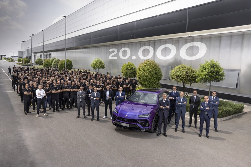 Lamborghini employees celebrate around the 20,000th Urus in Viola Mithras at the Sant'Agata Bolognese factory